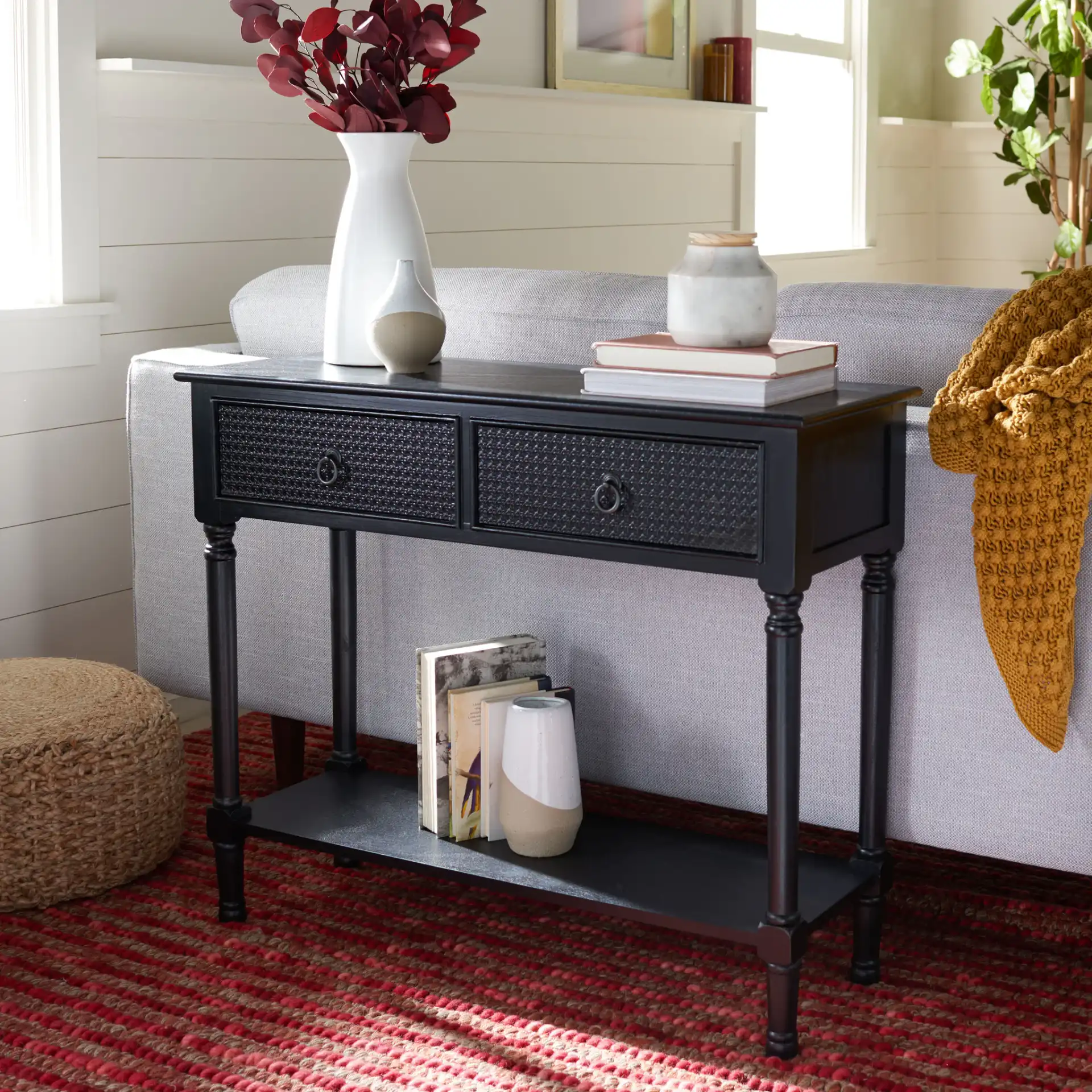 Haines Two-Drawer Console Table in Black in a styled room