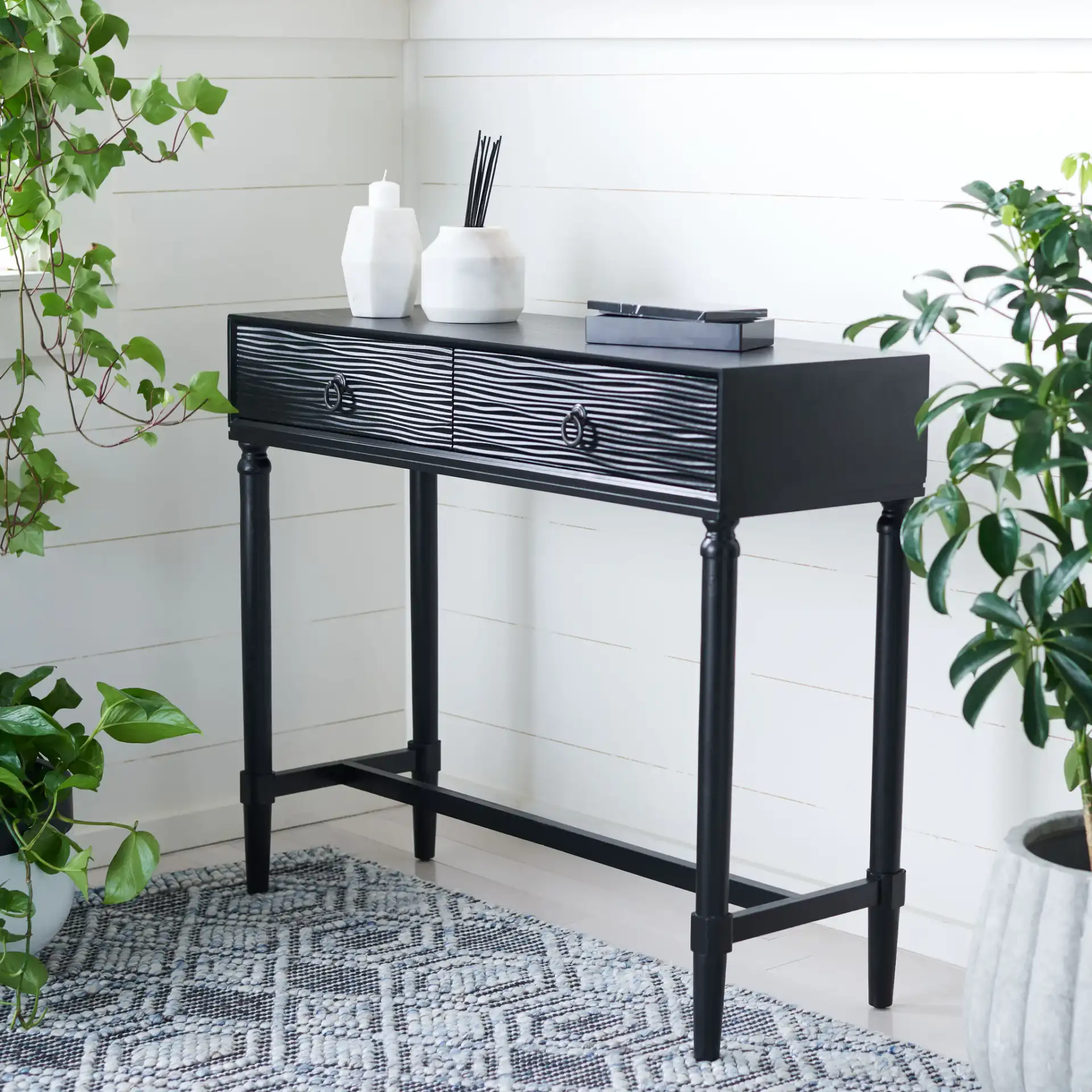 Aliyah Two-Drawer Console Table in Black in a styled room