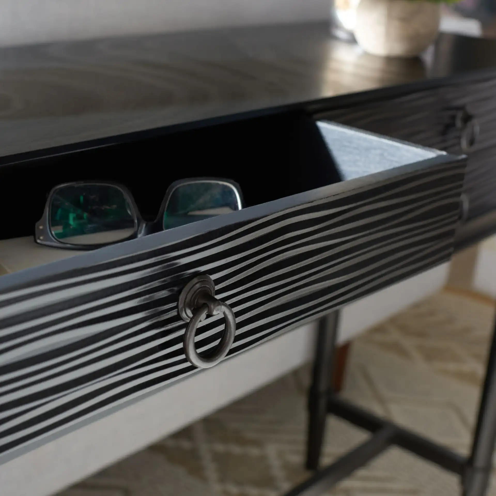 Aliyah Four-Drawer Console Table in Black in a styled room