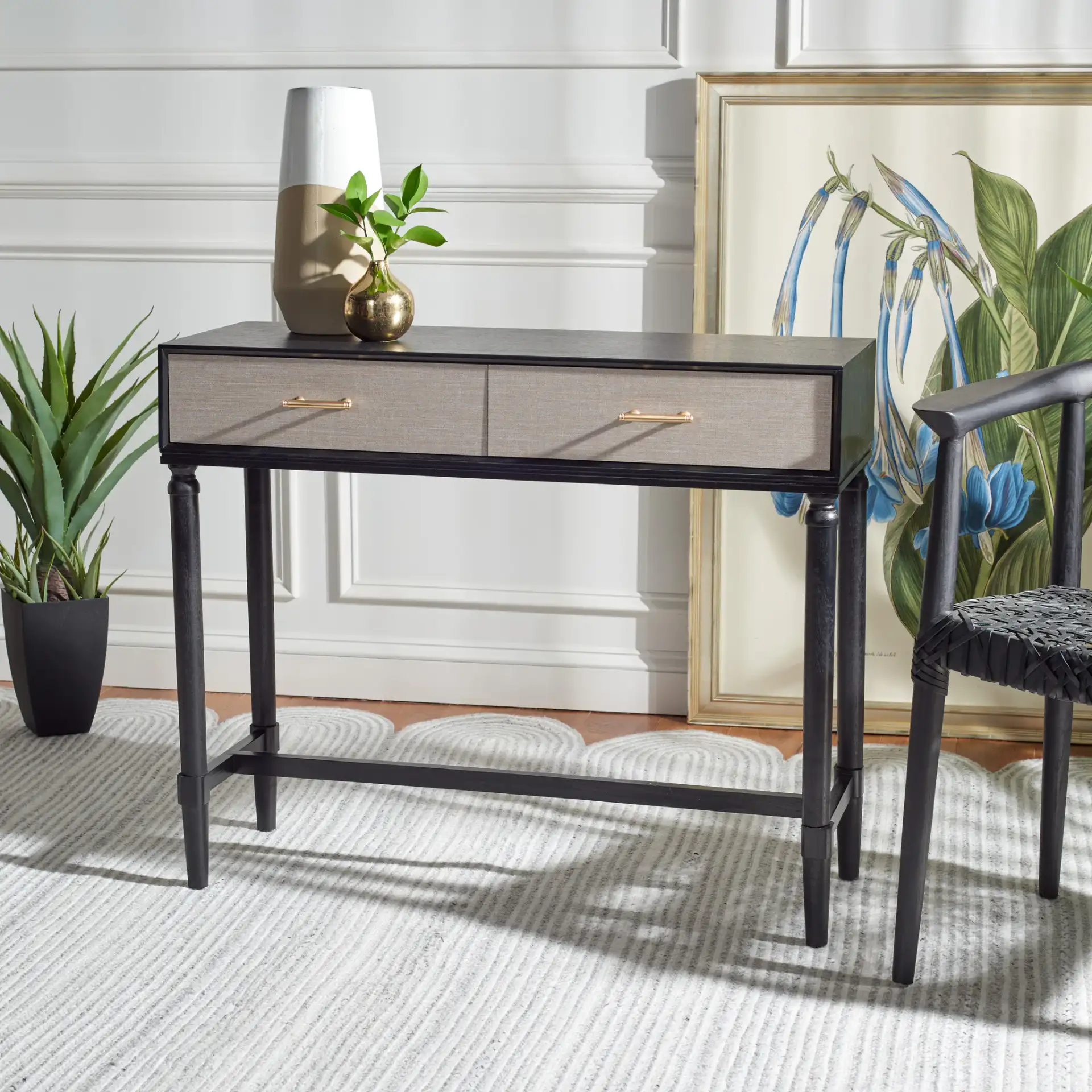 Estella Two-Drawer Console Table in Black in a styled room