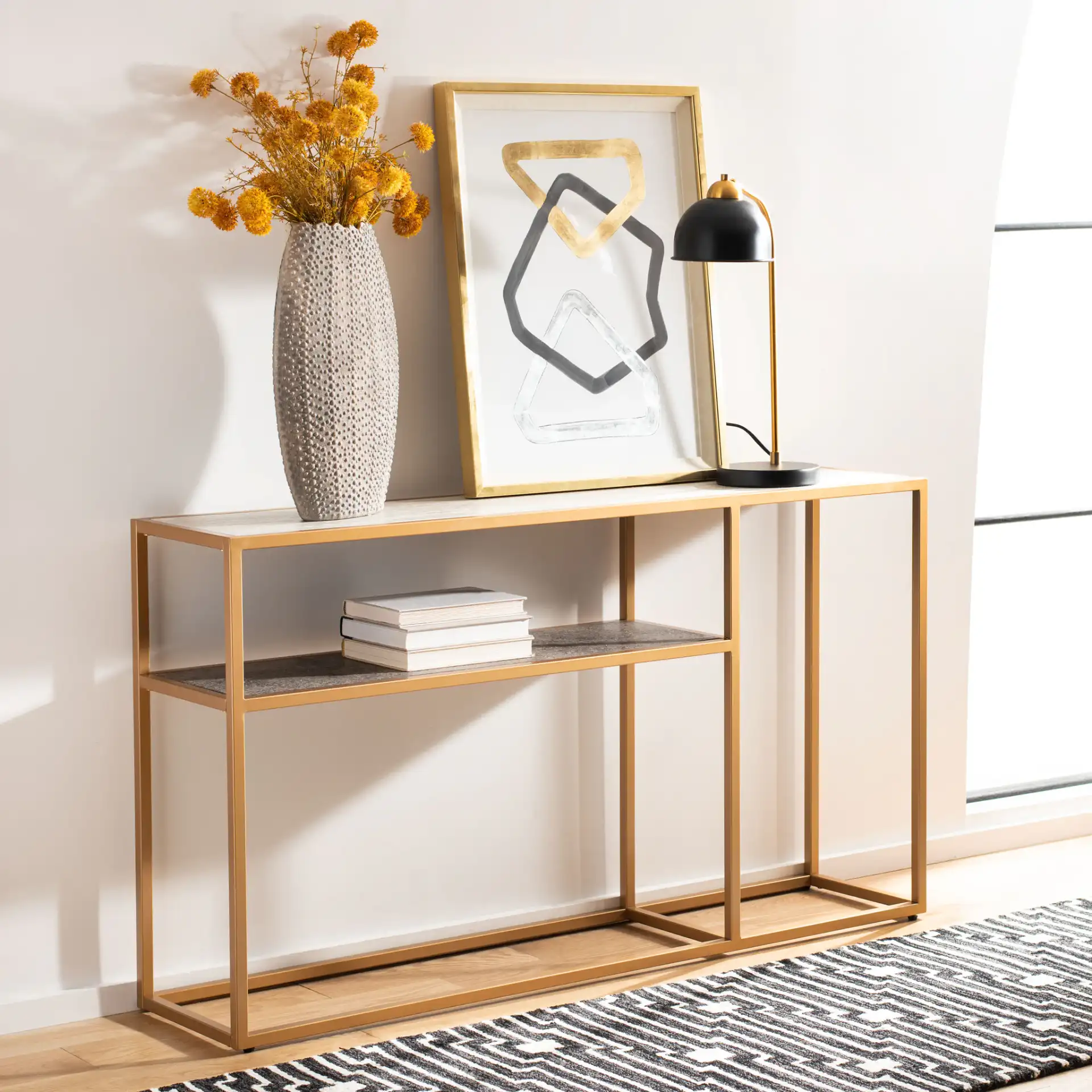 Octavia Console Table in Beige / Black / Gold in a styled room