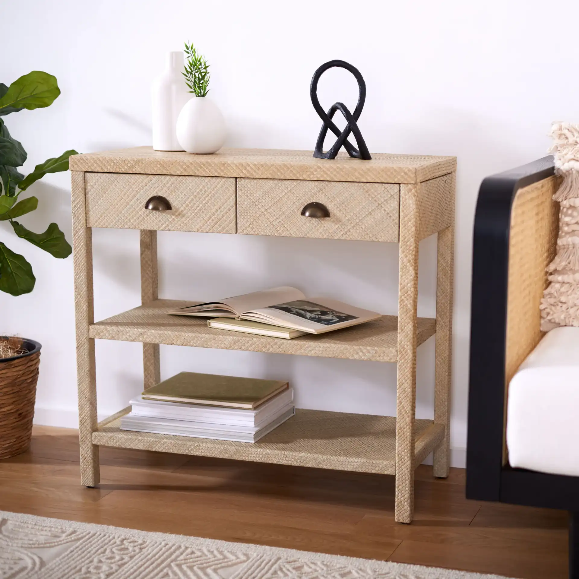 Apis Raffia Console Table in Light Natural / Gold in a styled room