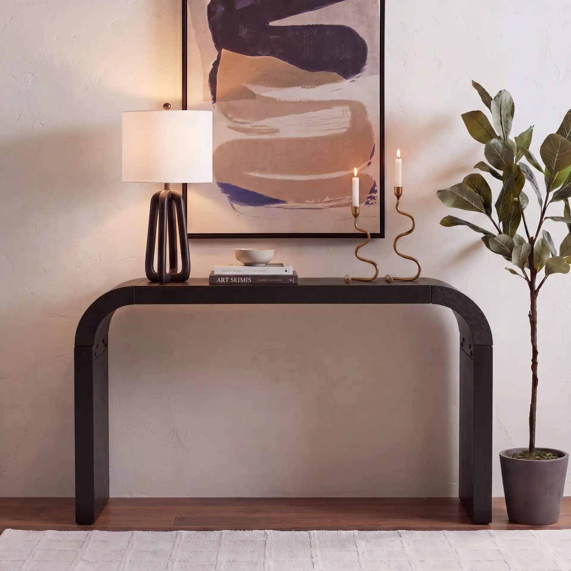 Liasonya Curved Console Table in Black in a styled room