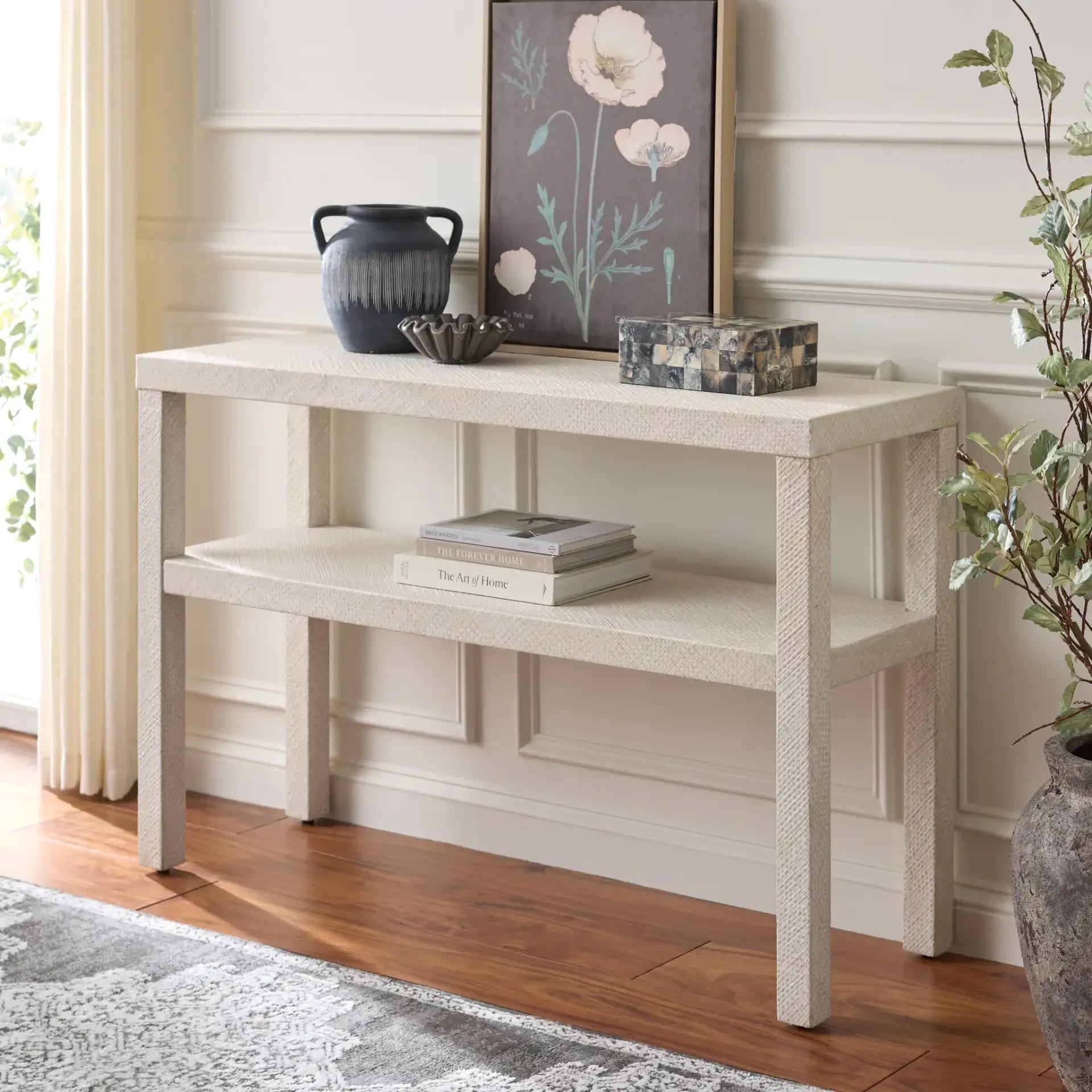 Apis Two-Shelf Console Table in White in a styled room