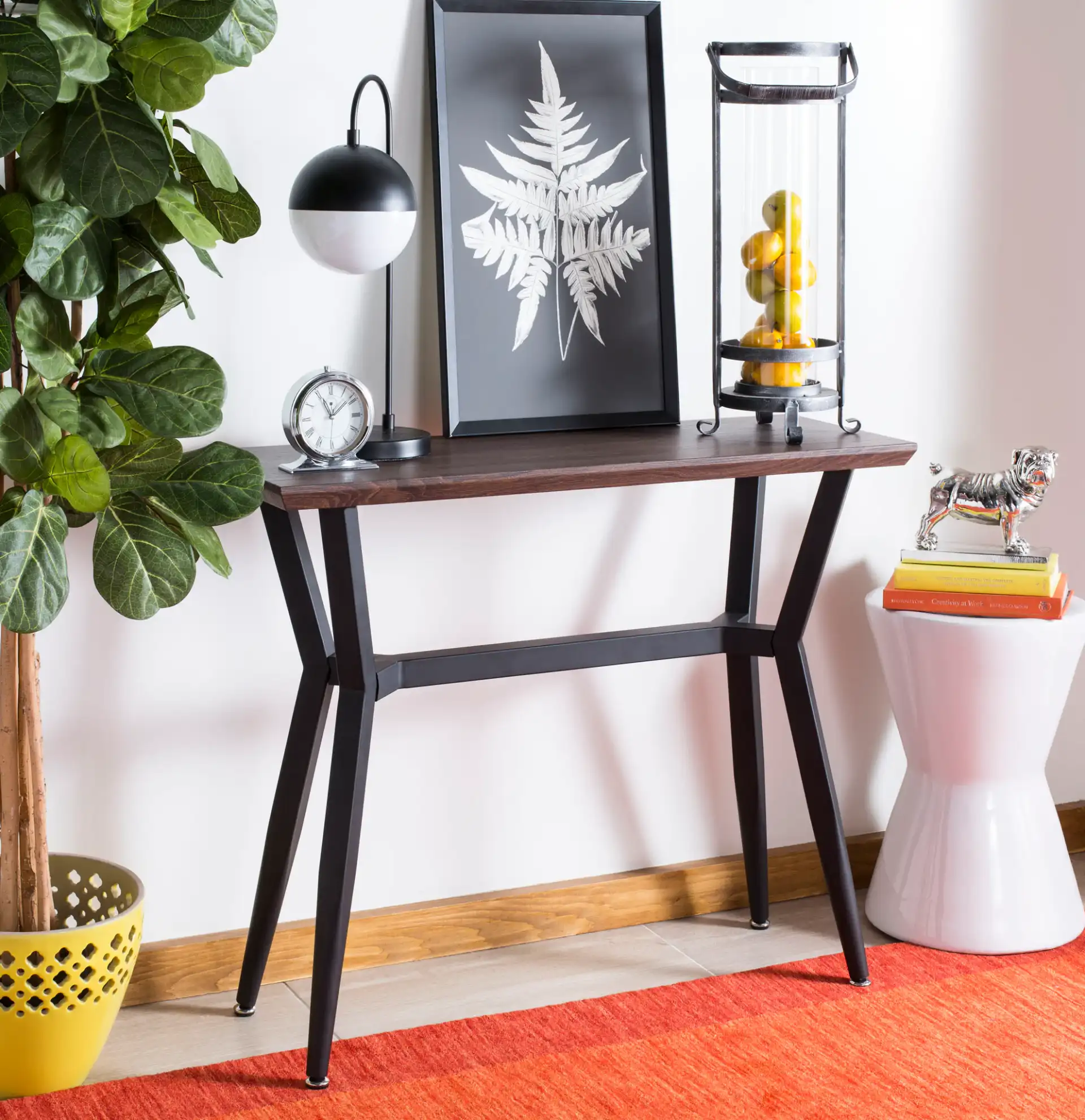 Andrew Console Table in Brown / Black in a styled room
