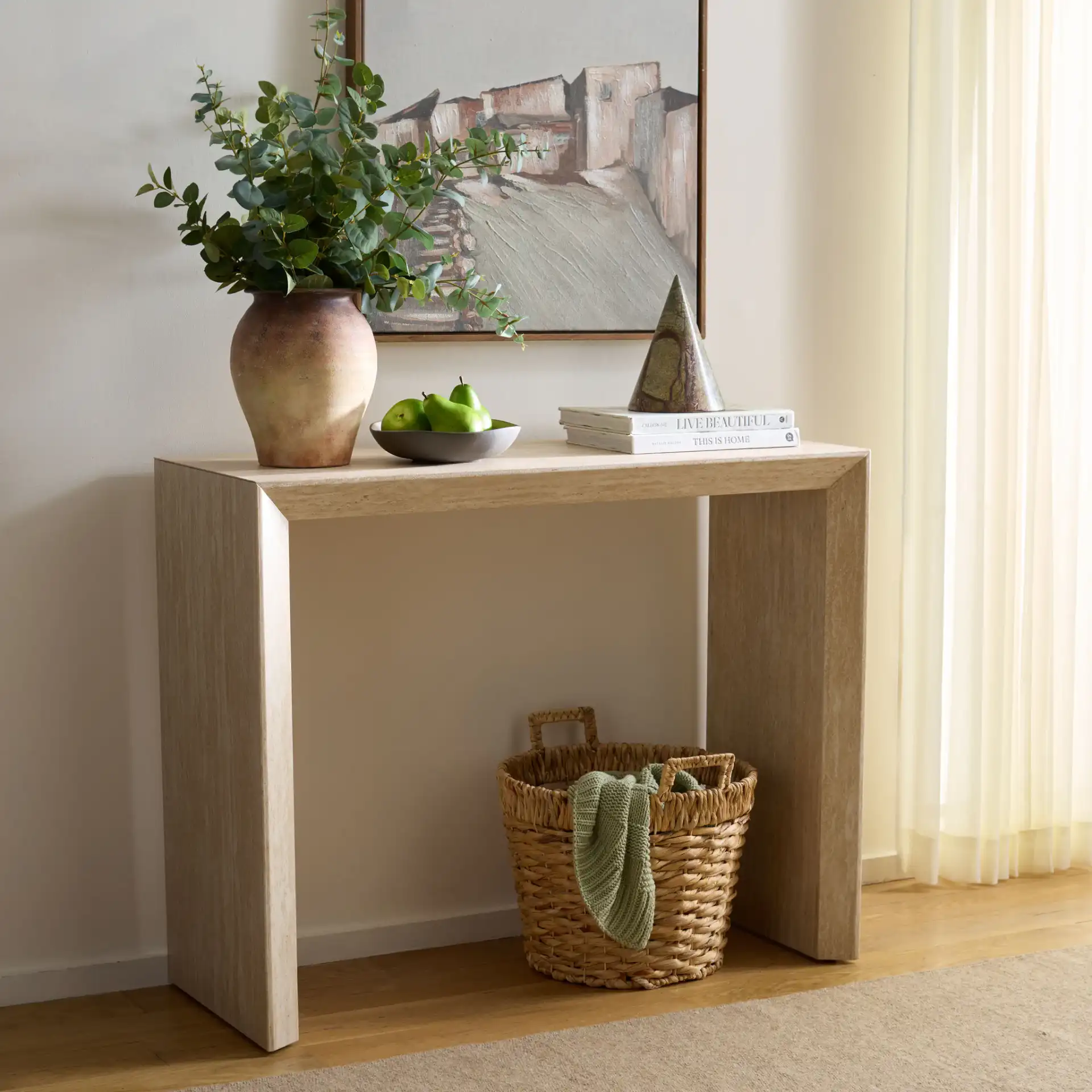 Woodrow Console Table in Faux Travertine in a styled room