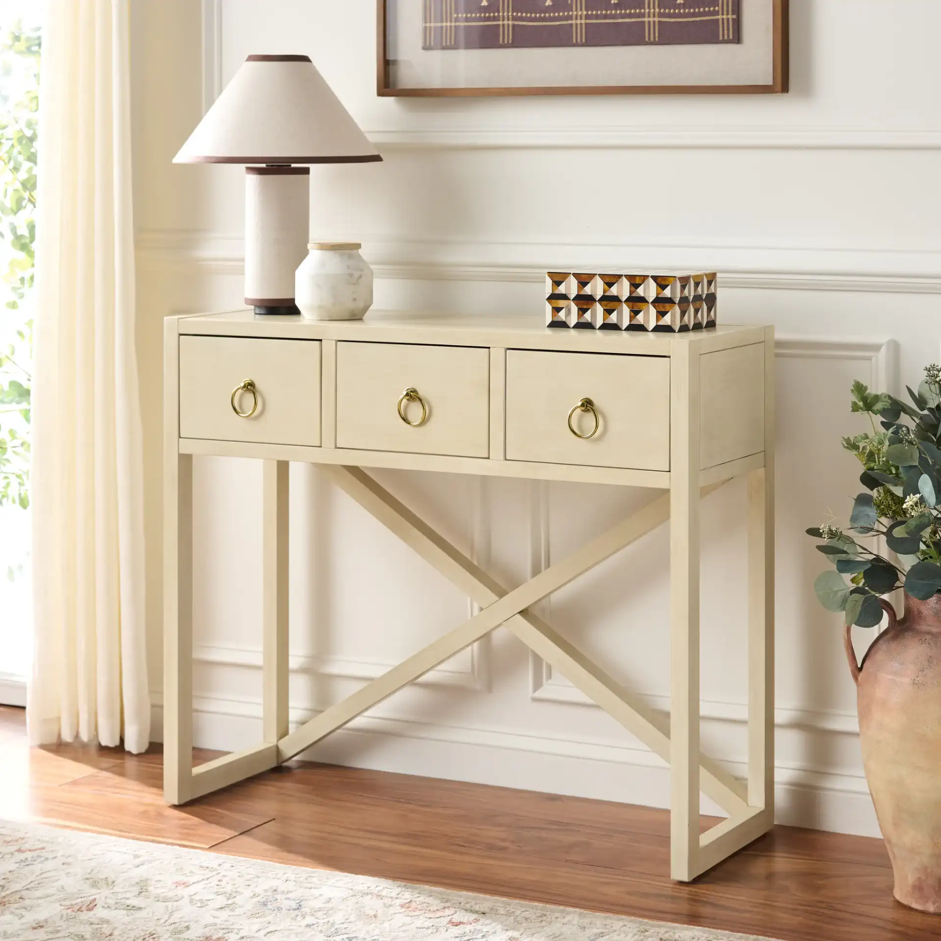 Sadie Three-Drawer Console Table in Antique / White in a styled room