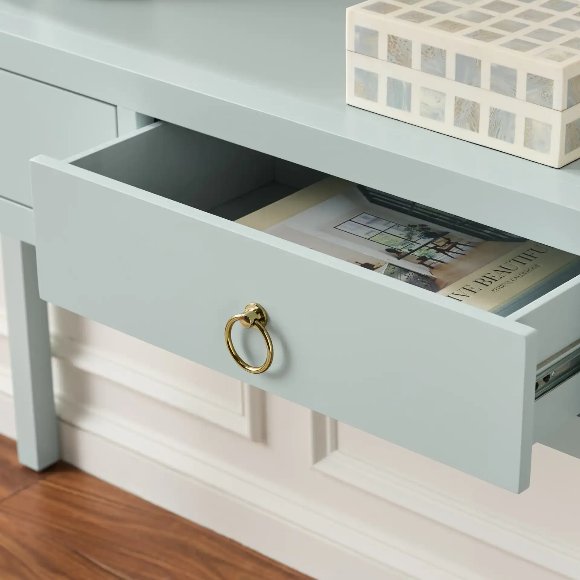 Moya Two-Drawer Console Table in Light Blue in a styled room