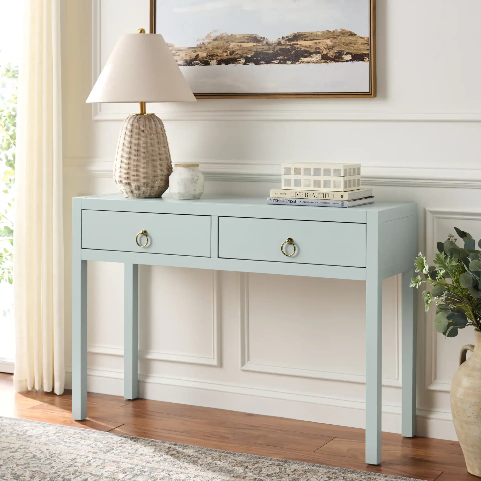 Moya Two-Drawer Console Table in Light Blue in a styled room