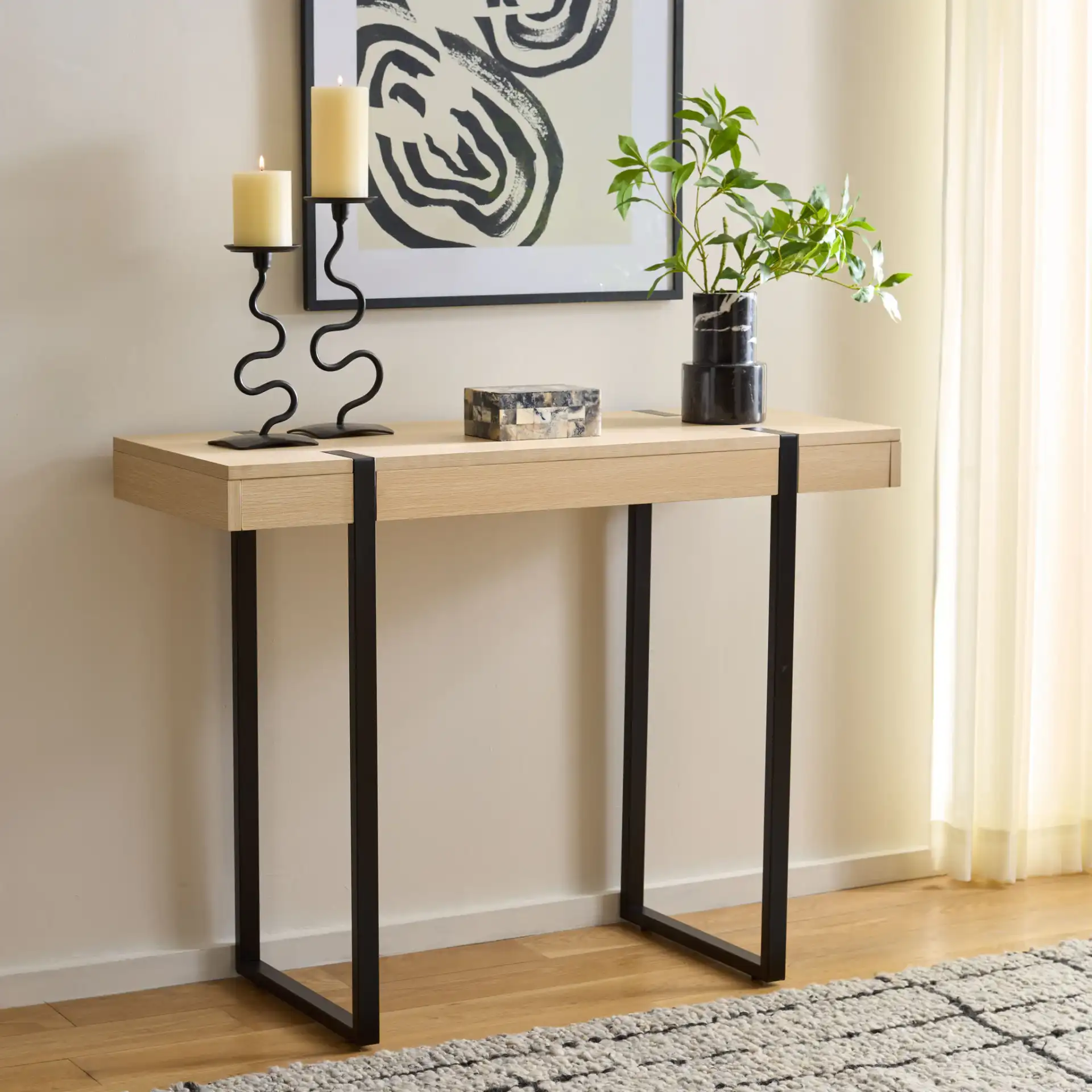 Klausner Console Table in Sand / Black in a styled room
