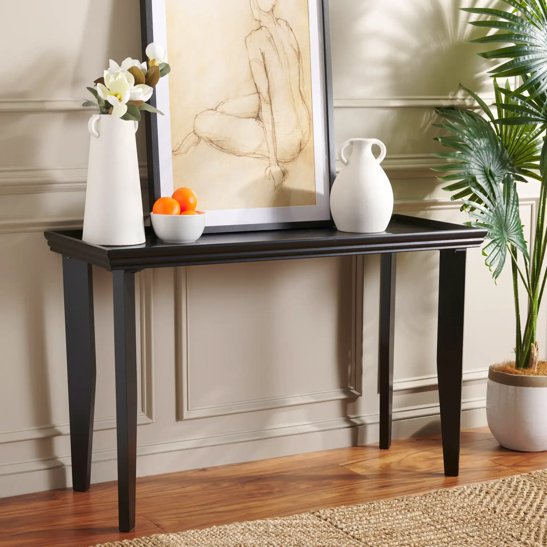 Naios Console Table in Black in a styled room