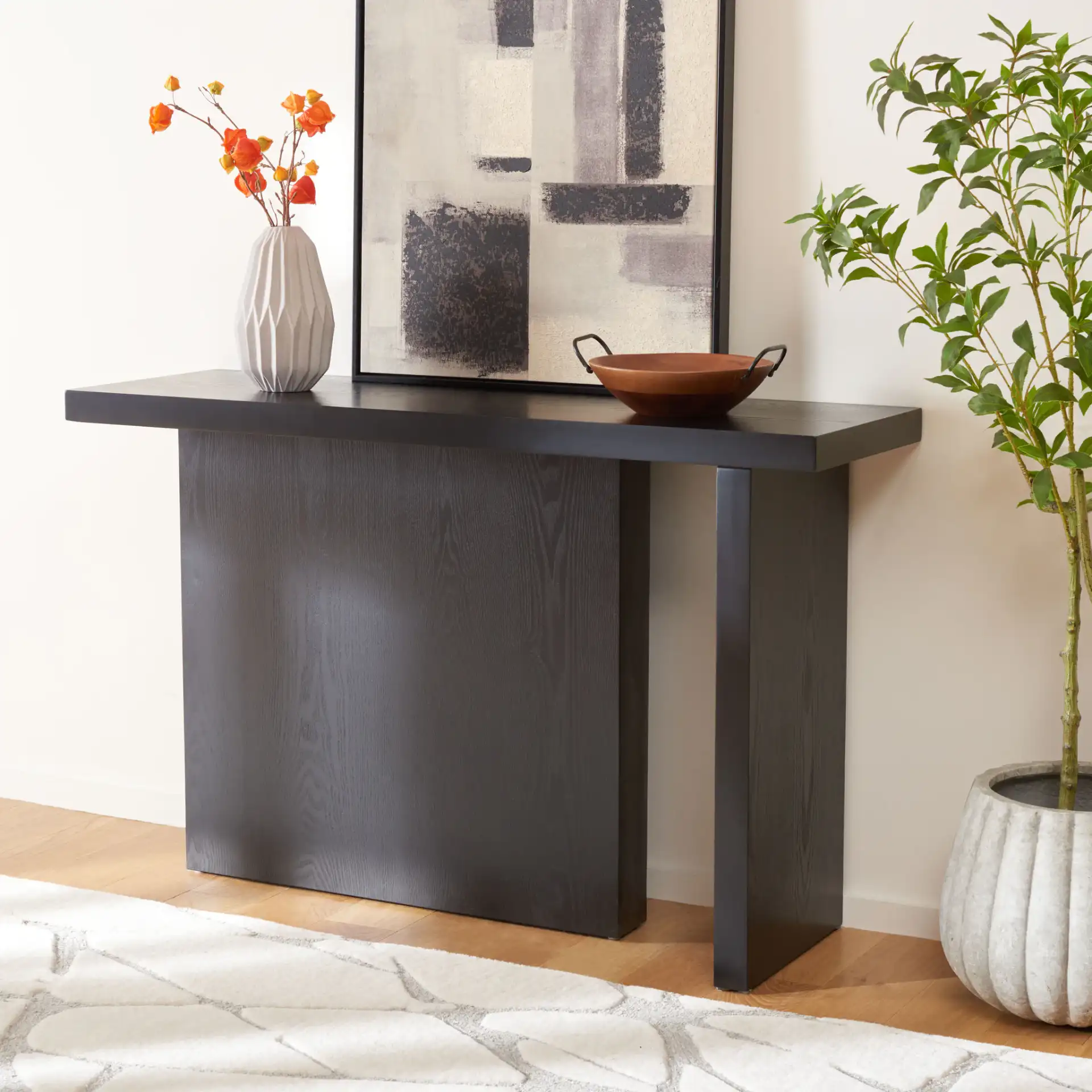 Assana Console Table in Black in a styled room