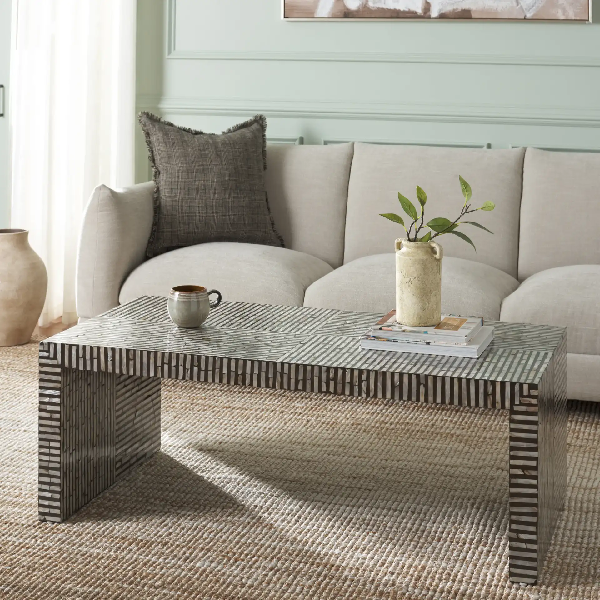 Hamza Rectangle Coffee Table in Multicolor / Black in a styled room