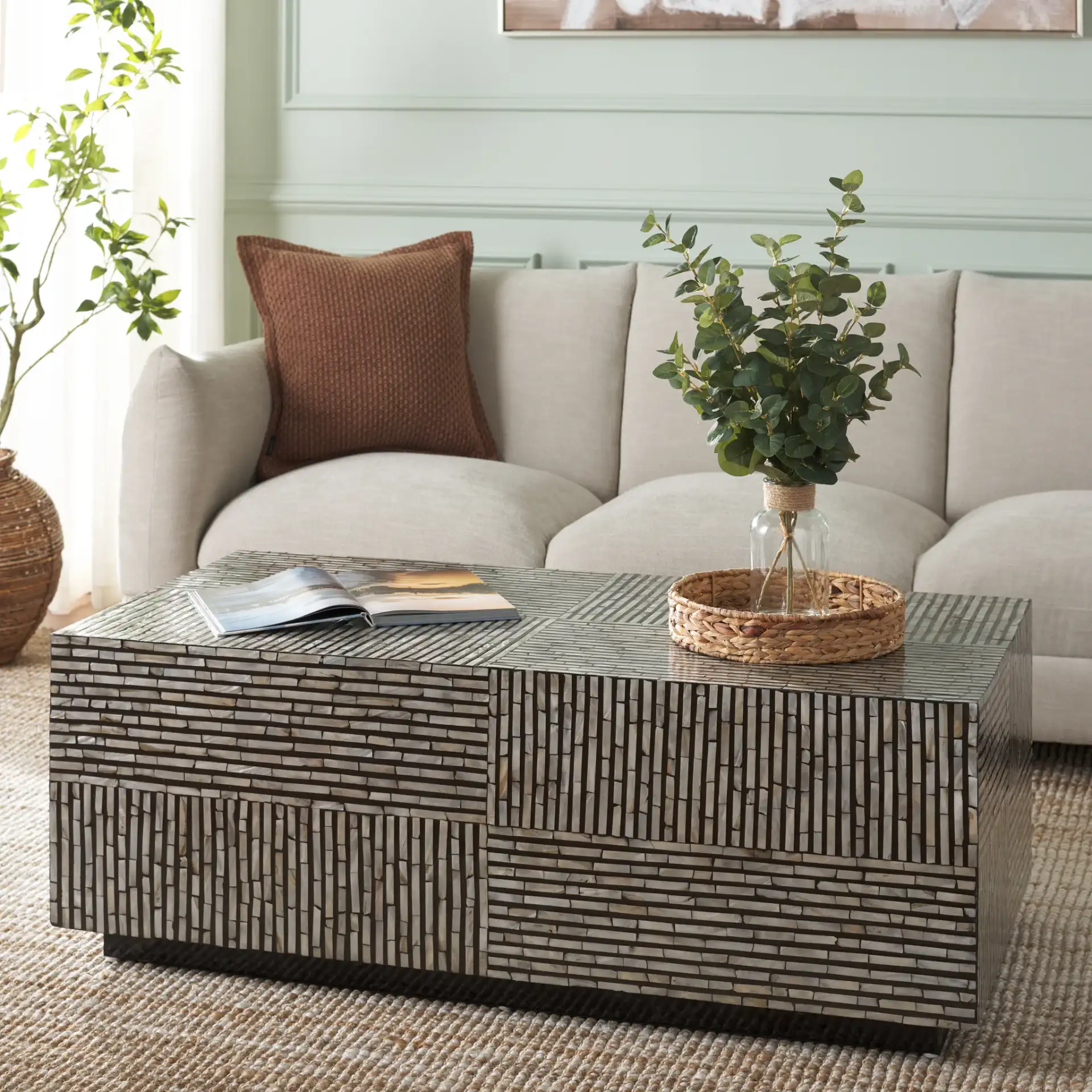 Hamza Rectangular Prism Coffee Table in Multicolor / Black in a styled room