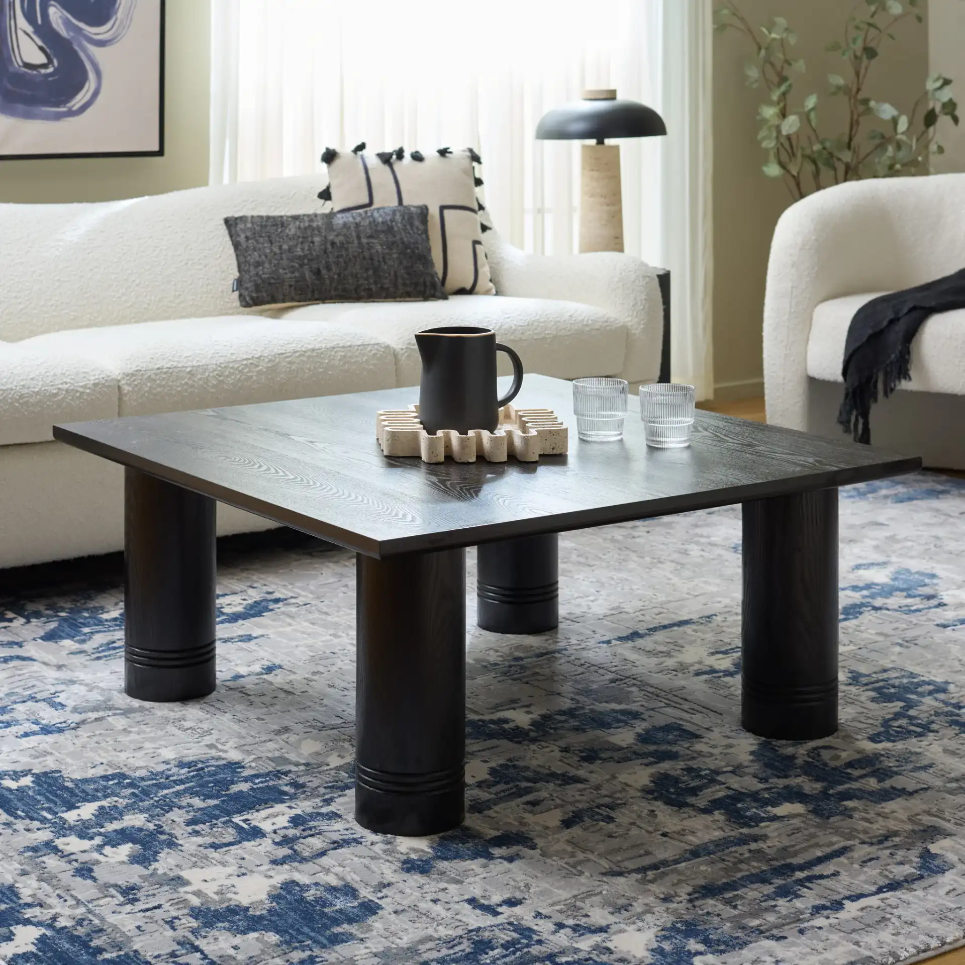 Aramin Coffee Table in Black in a styled room
