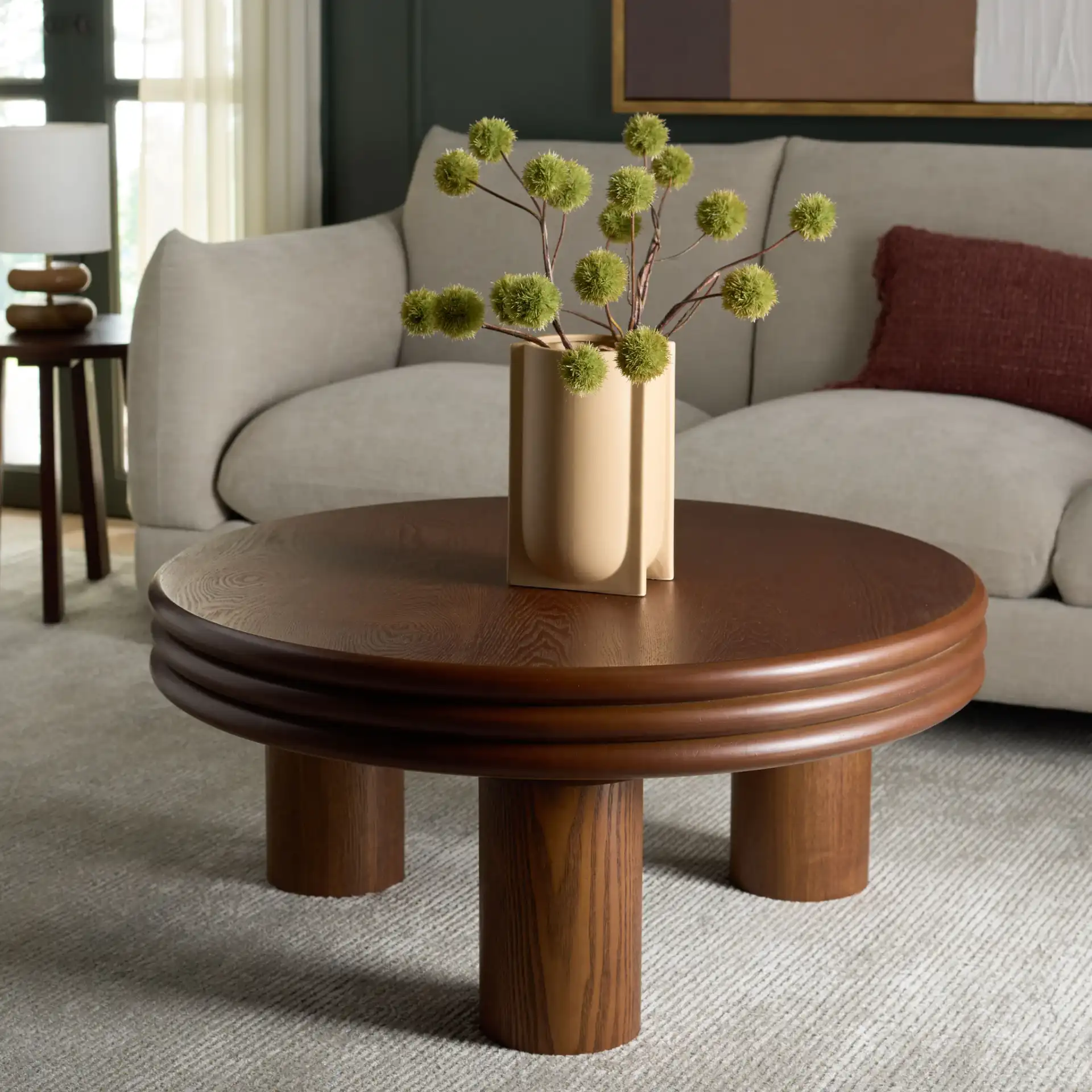 Averny Round Coffee Table in Walnut in a styled room