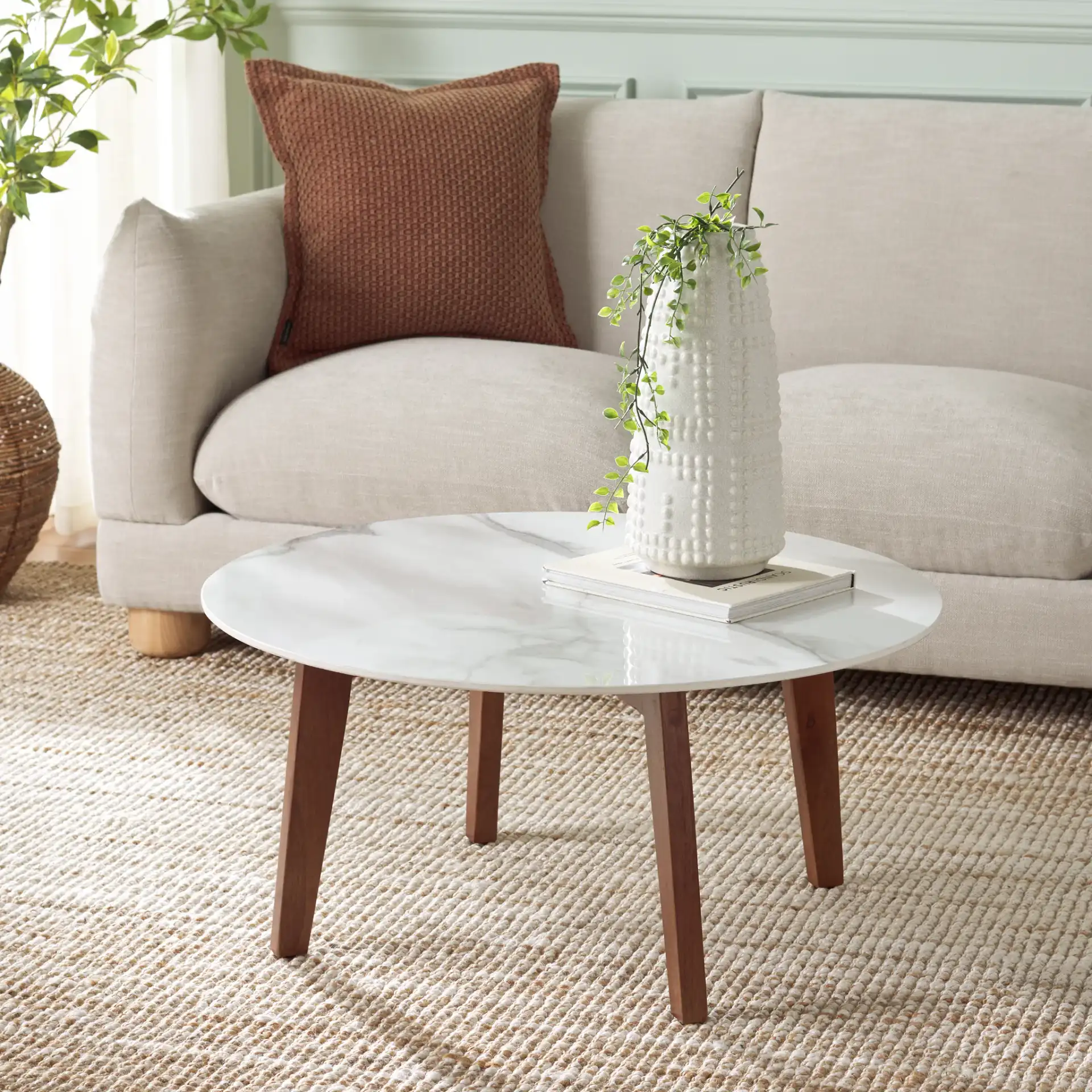 Ulmani Coffee Table in White Ceramic Faux Marble / Walnut in a styled room