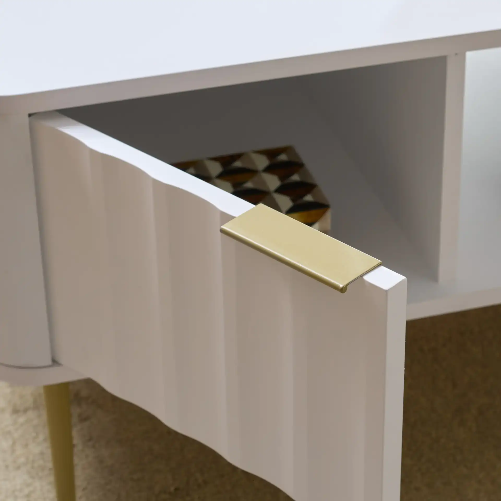 Hilsa Coffee Table in White / Gold in a styled room