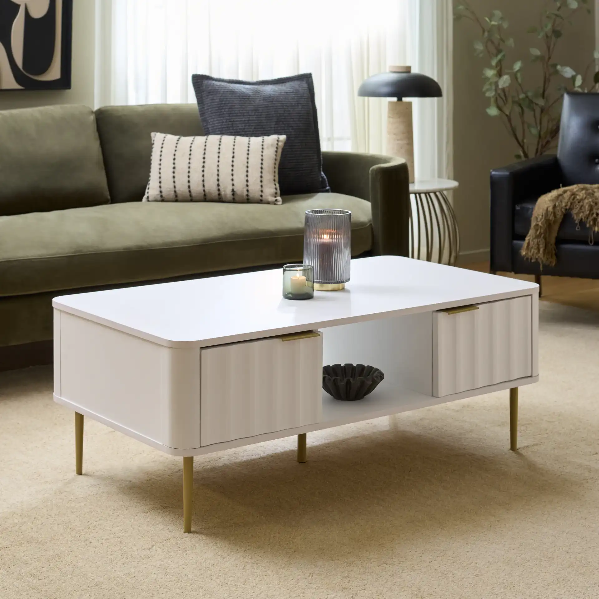 Hilsa Coffee Table in White / Gold in a styled room