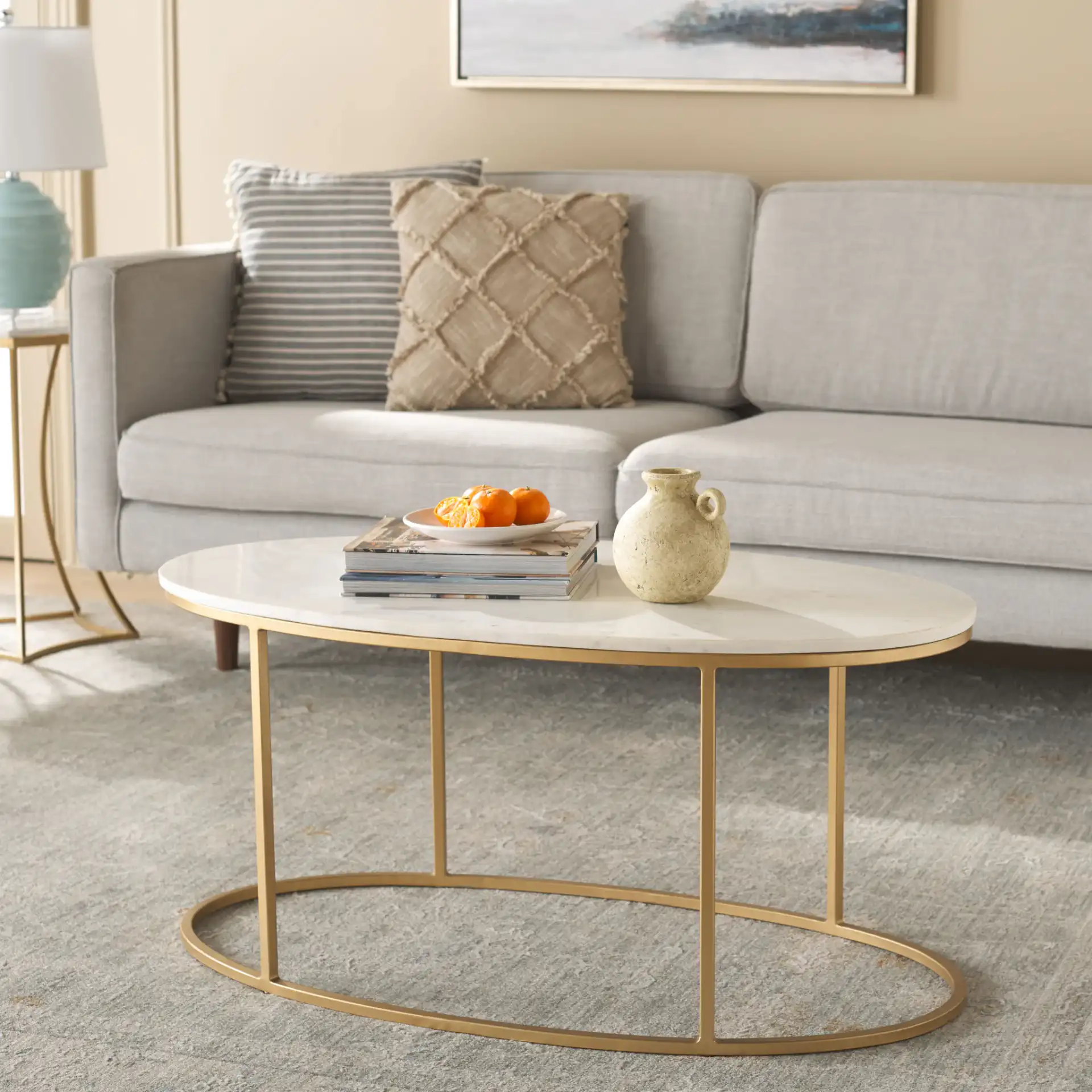 Tage Marble Coffee Table in White Marble / Gold in a styled room