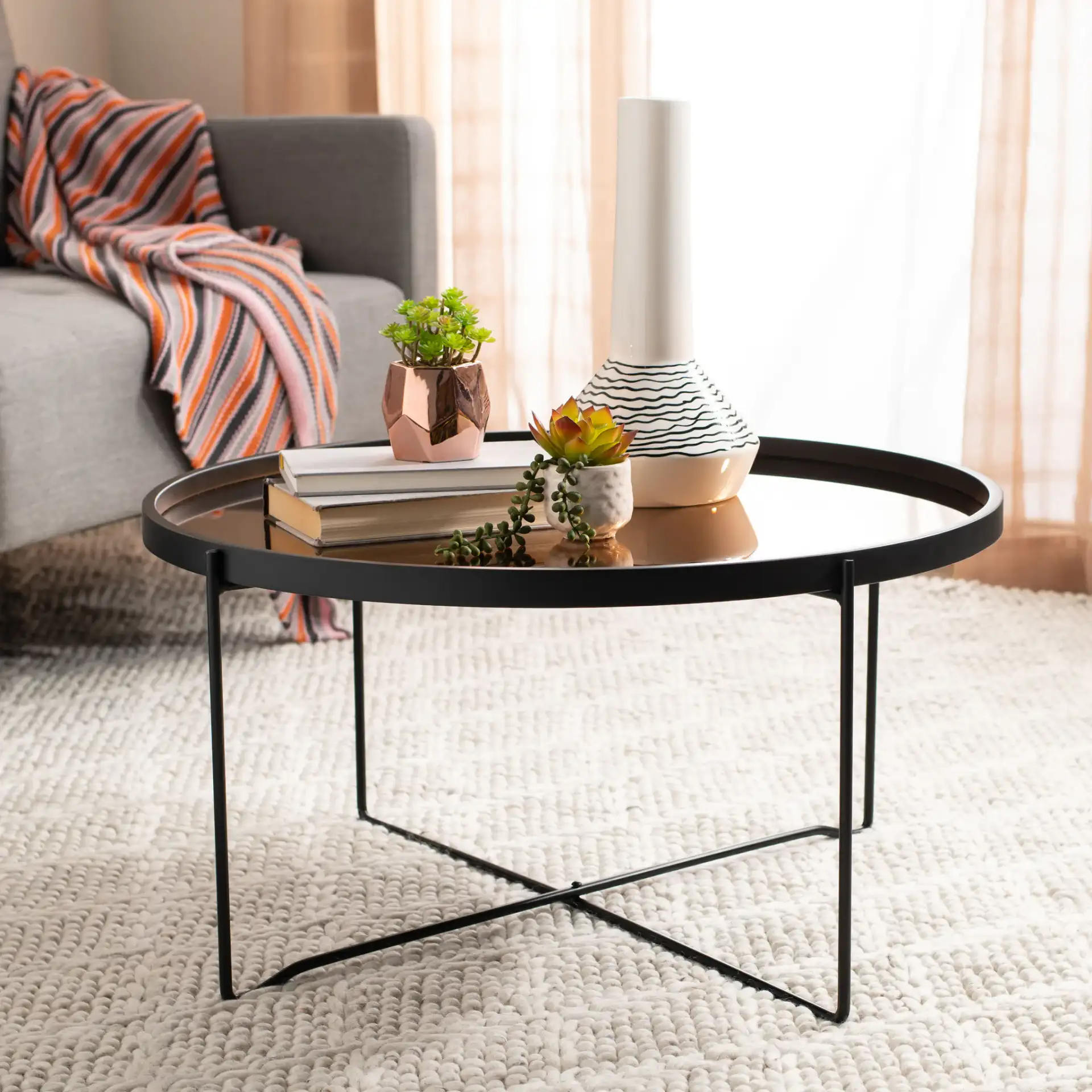 Ruby Tray Top Coffee Table in Rose Gold / Black in a styled room