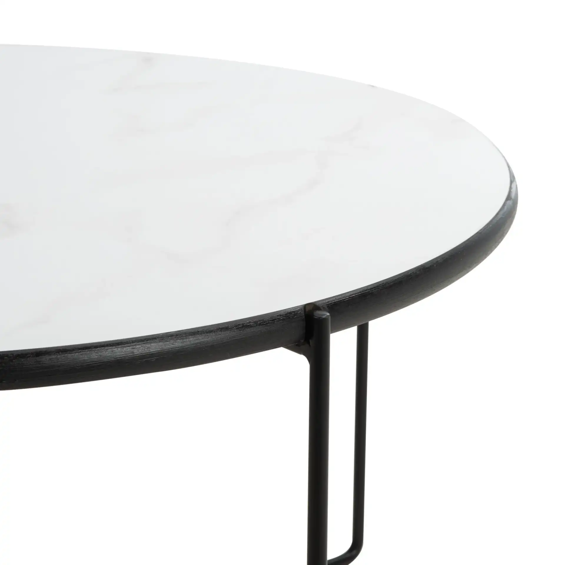 Wrena Round Coffee Table in White / Black in a styled room