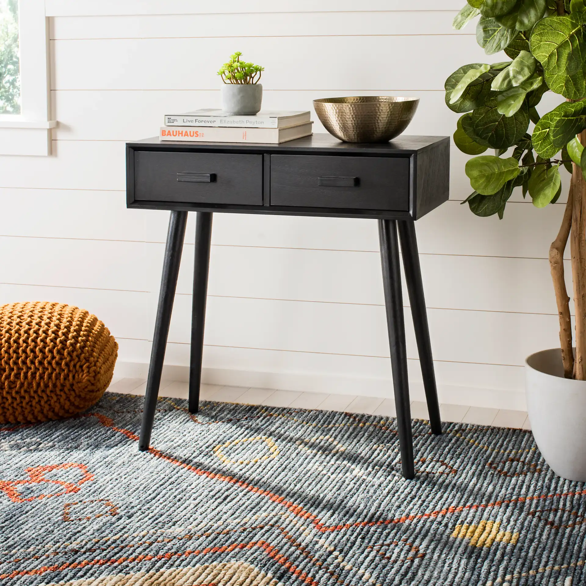 Dean Two-Drawer Console Table in Black in a styled room