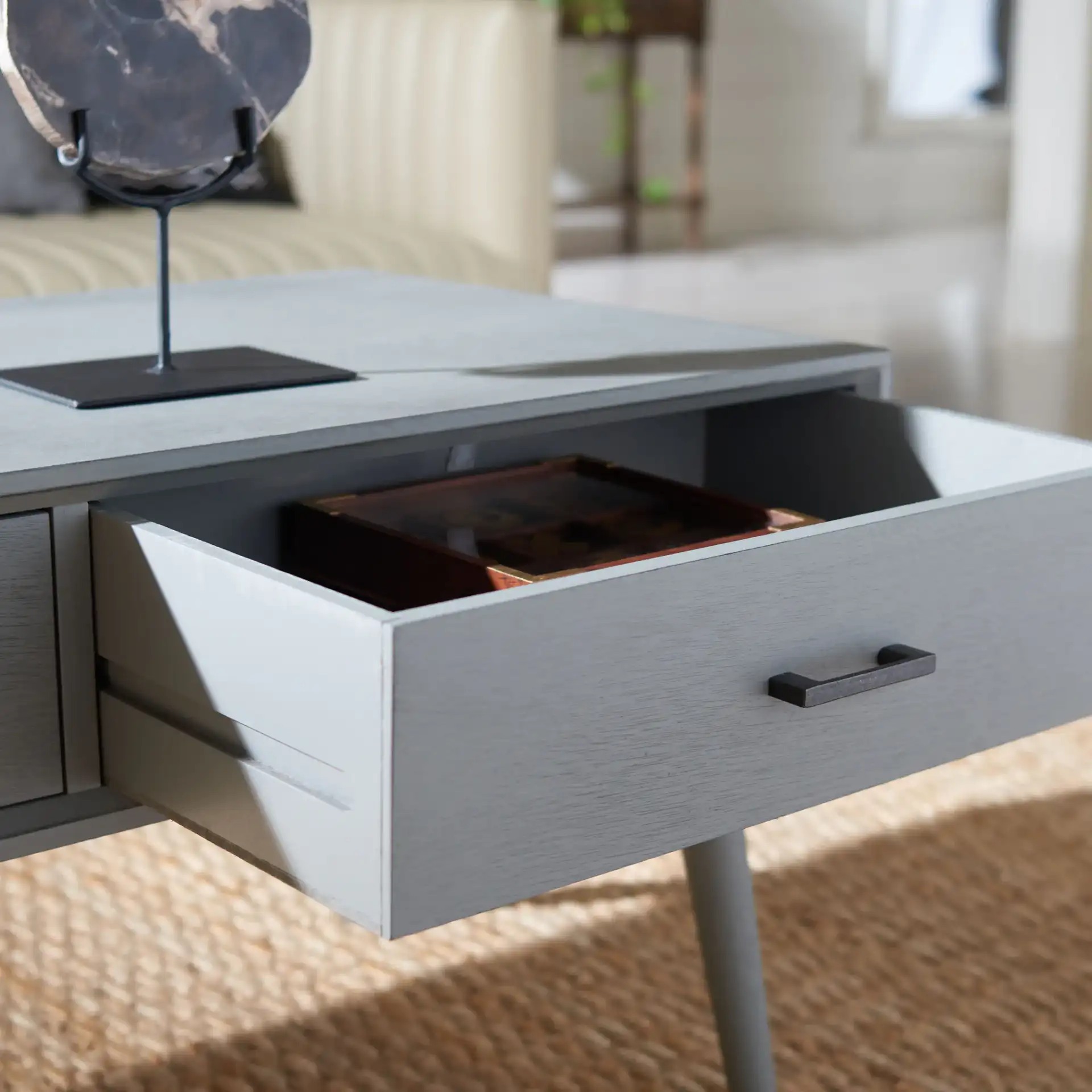 Mozart Mid-Century Coffee Table in Distressed Gray in a styled room