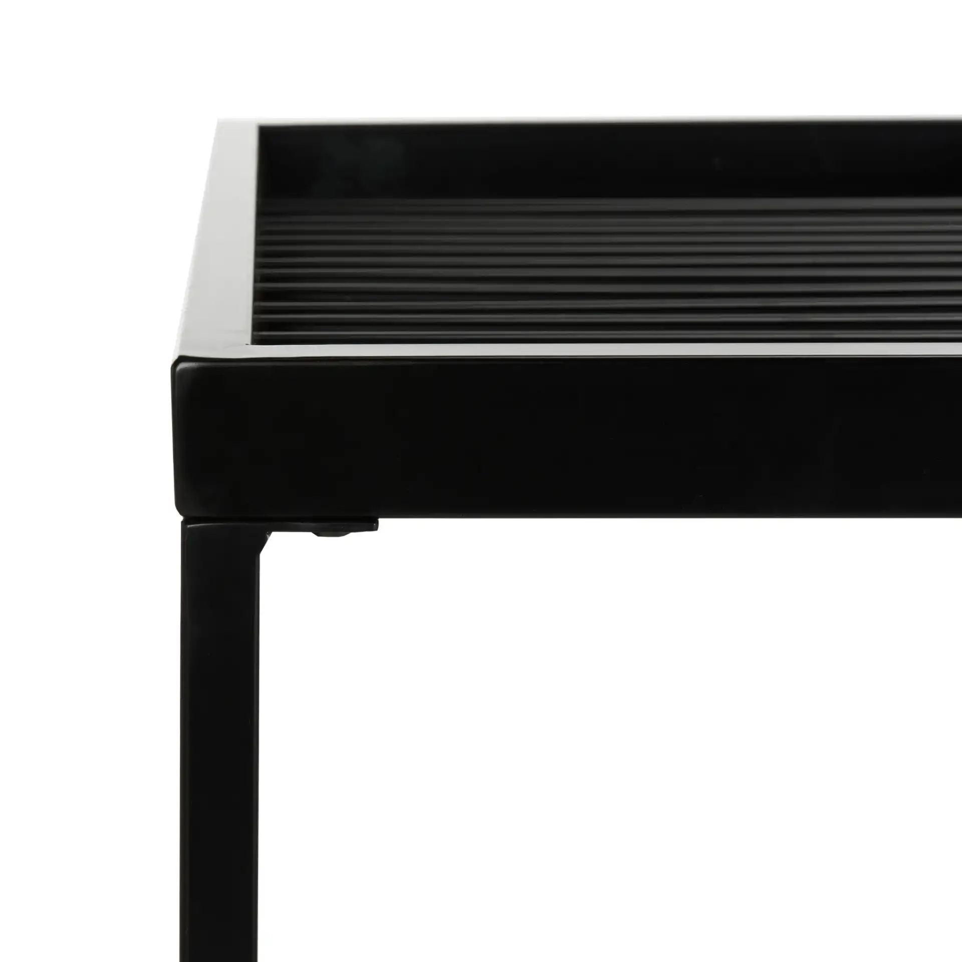 Zuri Coffee Table in White / Matte Black in a styled room