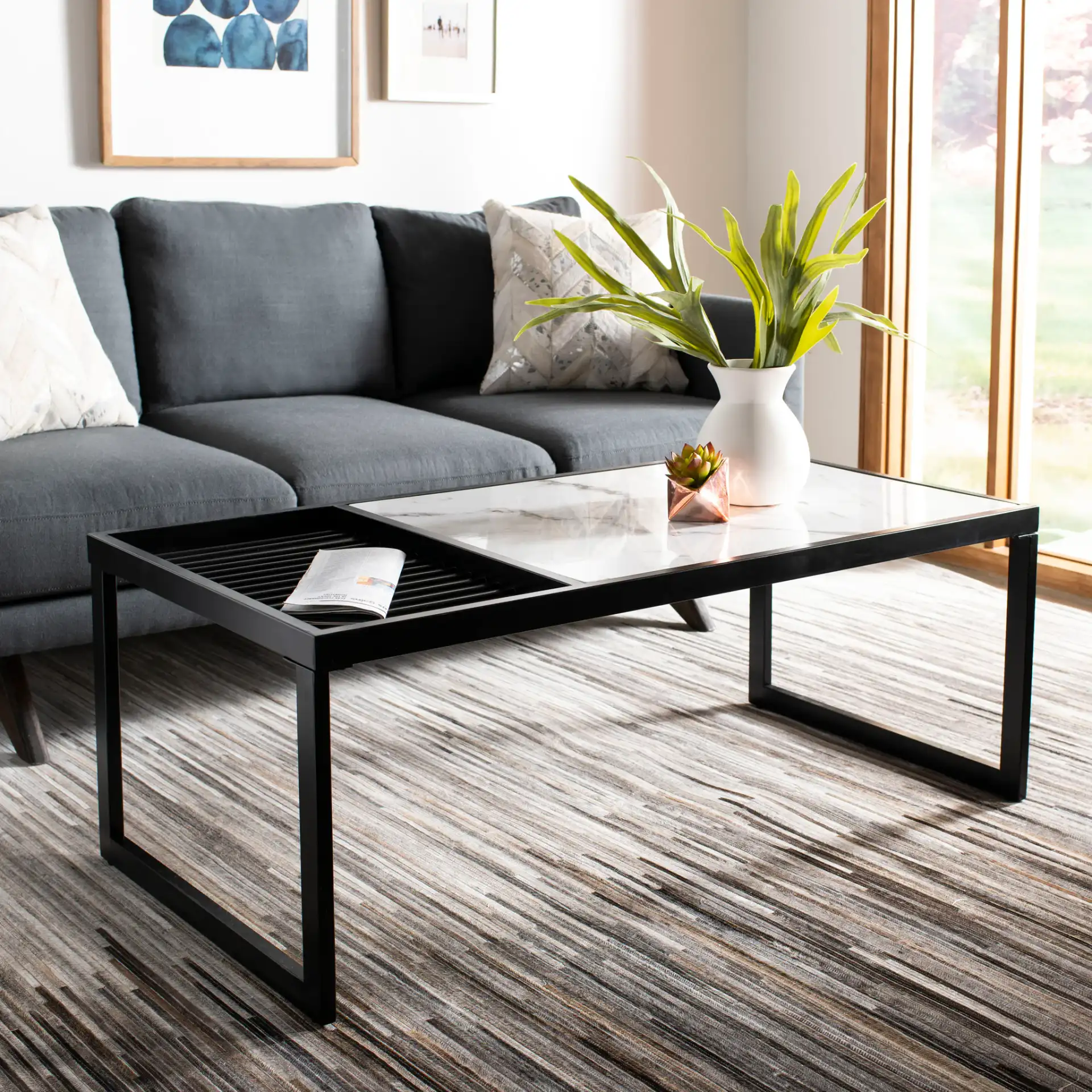 Zuri Coffee Table in White / Matte Black in a styled room