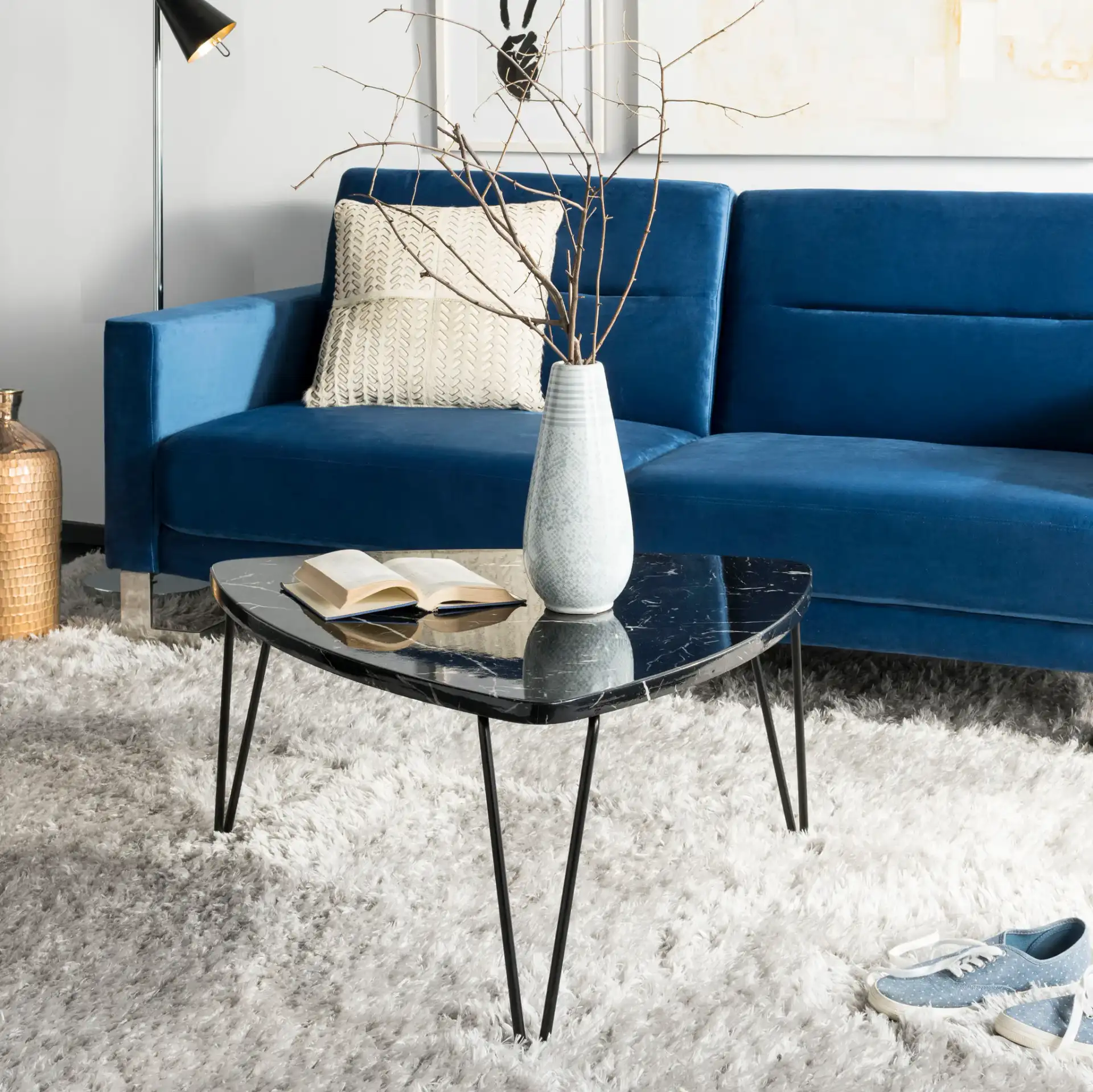 Jacky Triangle Coffee Table in Black in a styled room