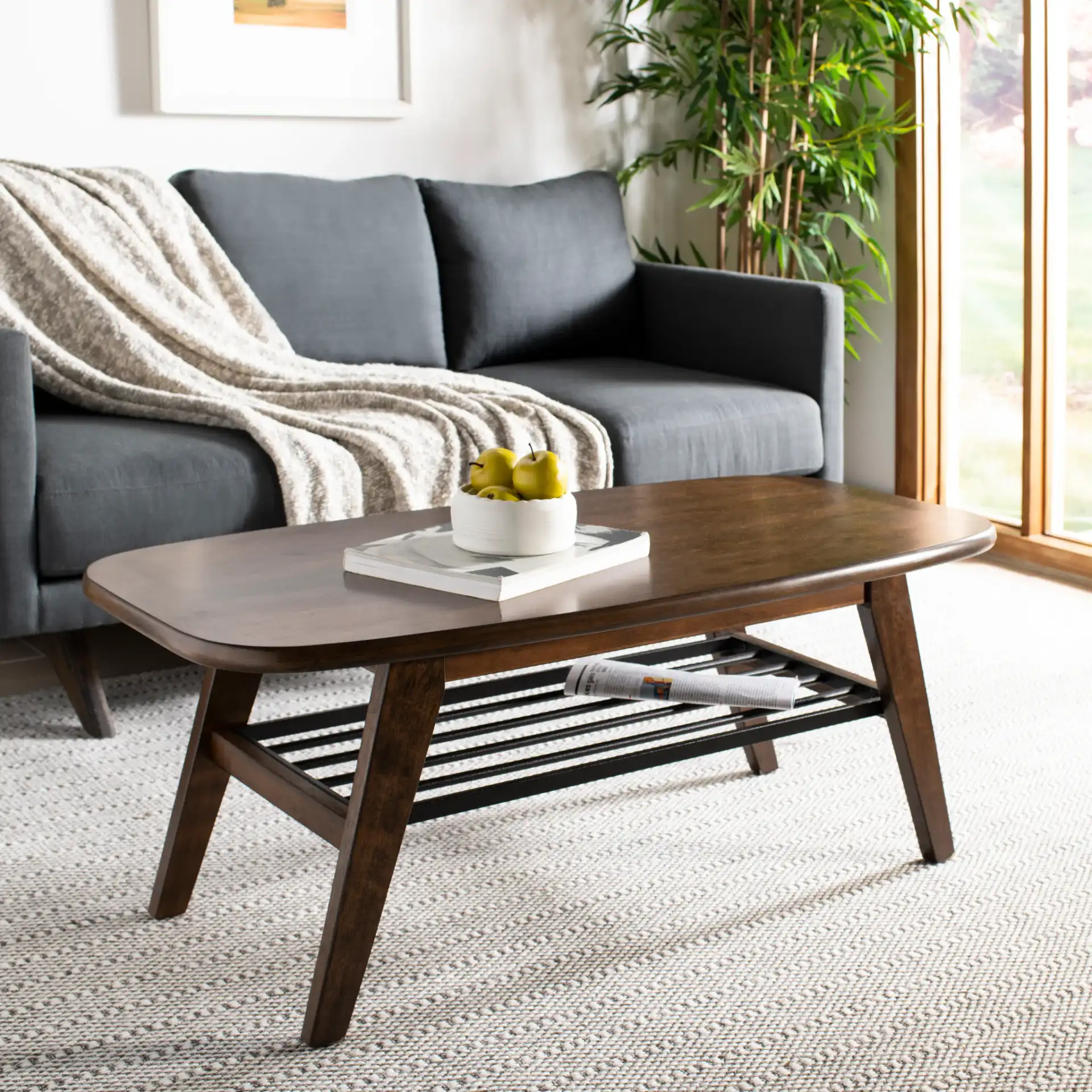 Oren Two-Tier Coffee Table in Walnut / Black Metal in a styled room
