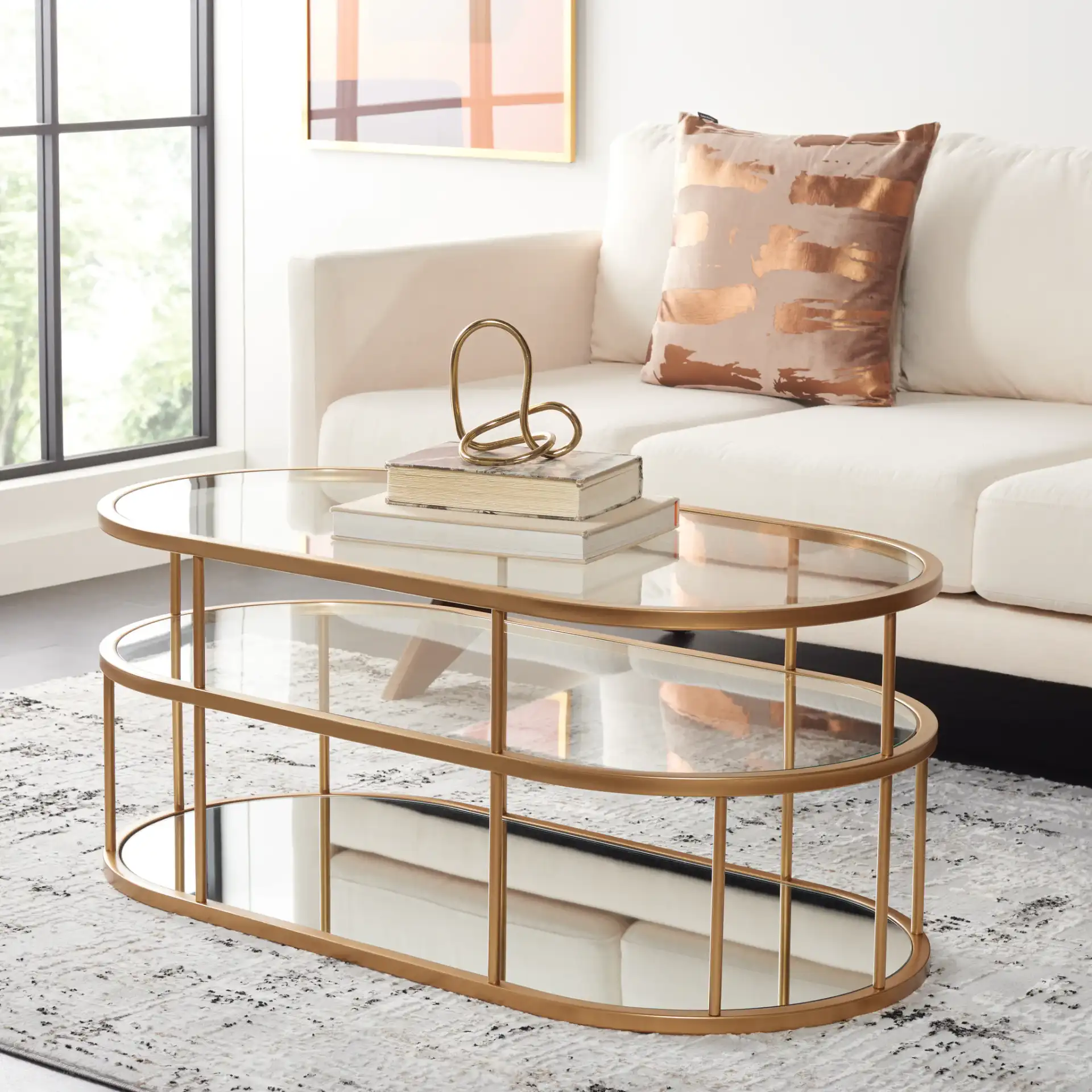 Layta Three-Shelf Coffee Table in Black / Clear in a styled room