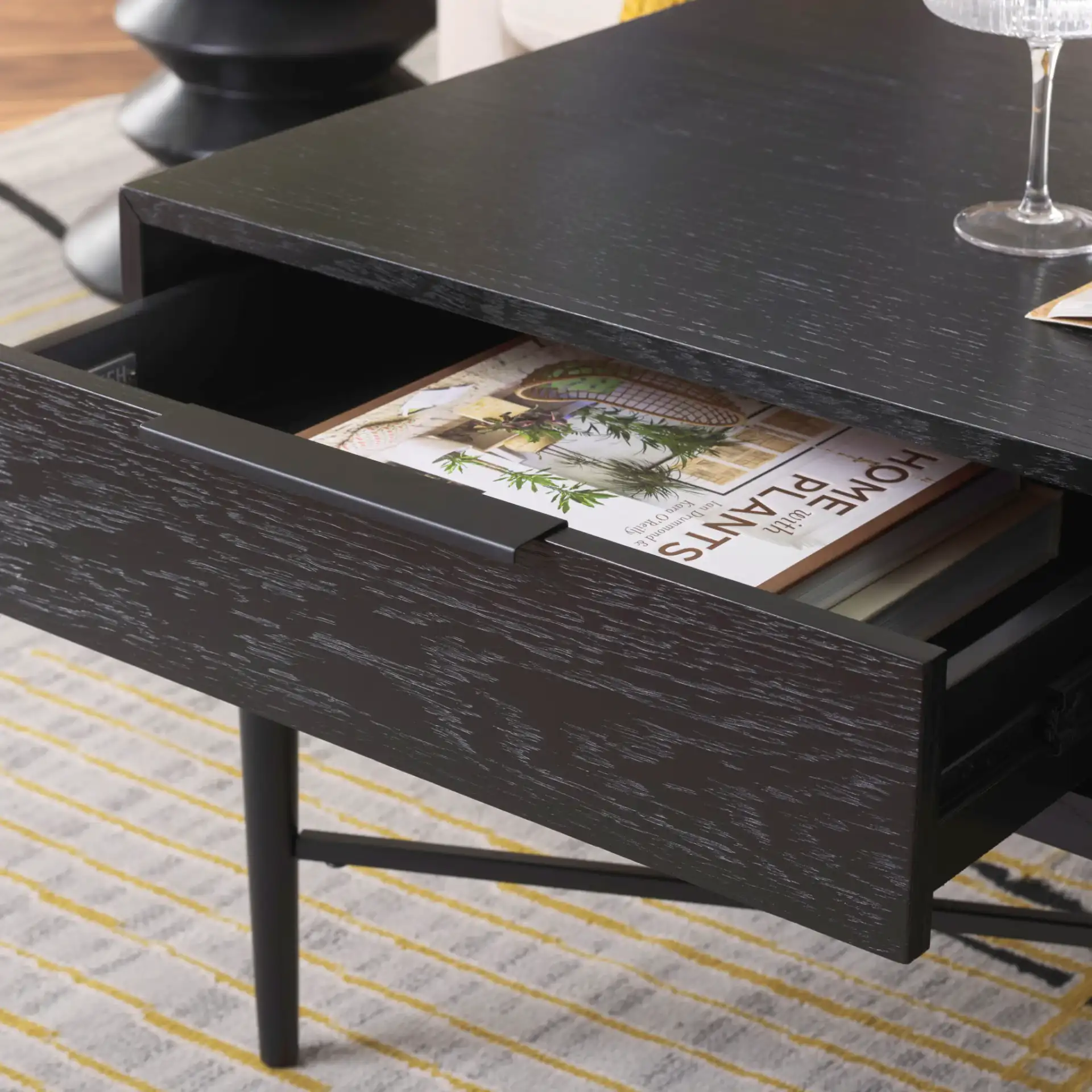 Pierre Two-Drawer Coffee Table in Black in a styled room