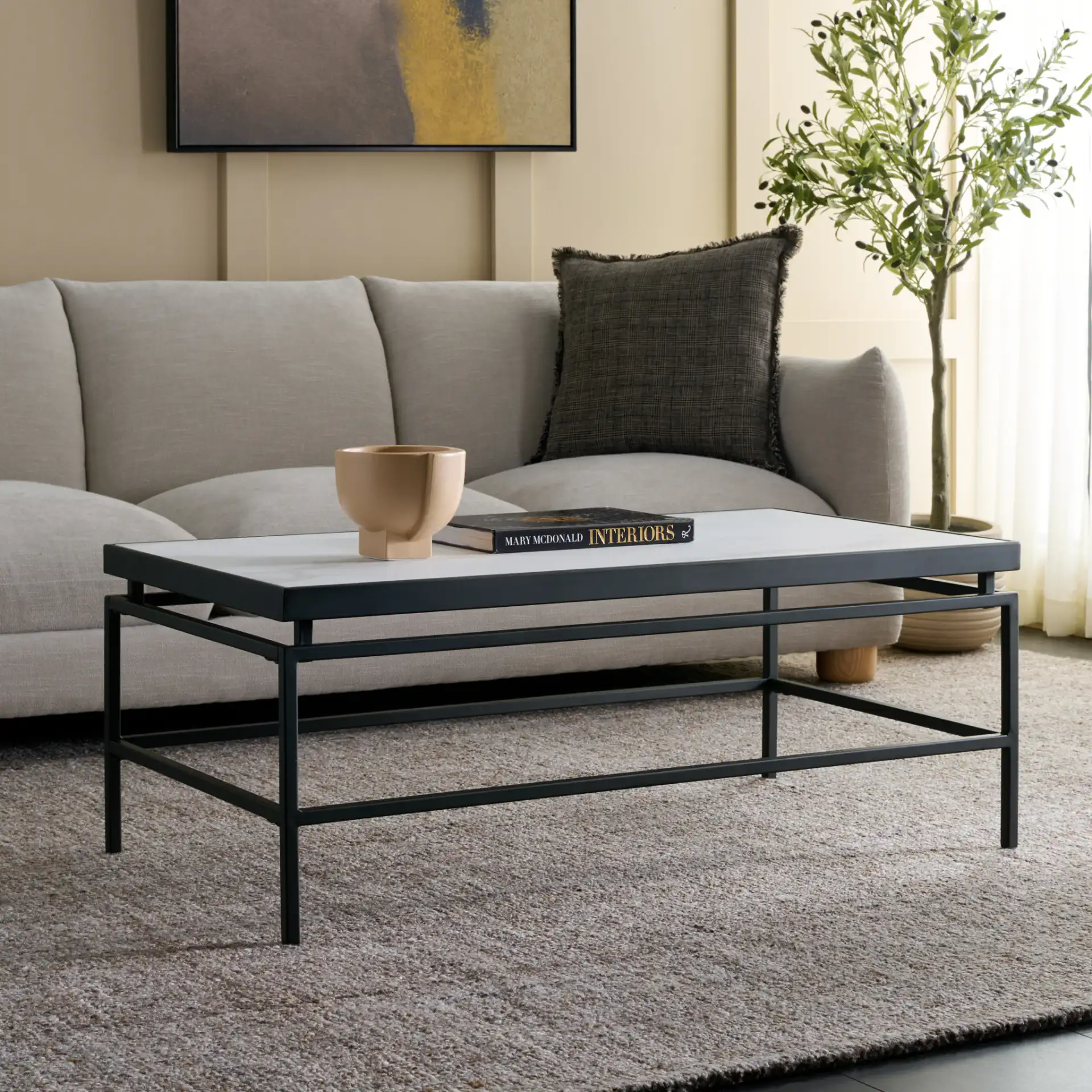 Acelin Coffee Table in White Faux Marble / Black in a styled room