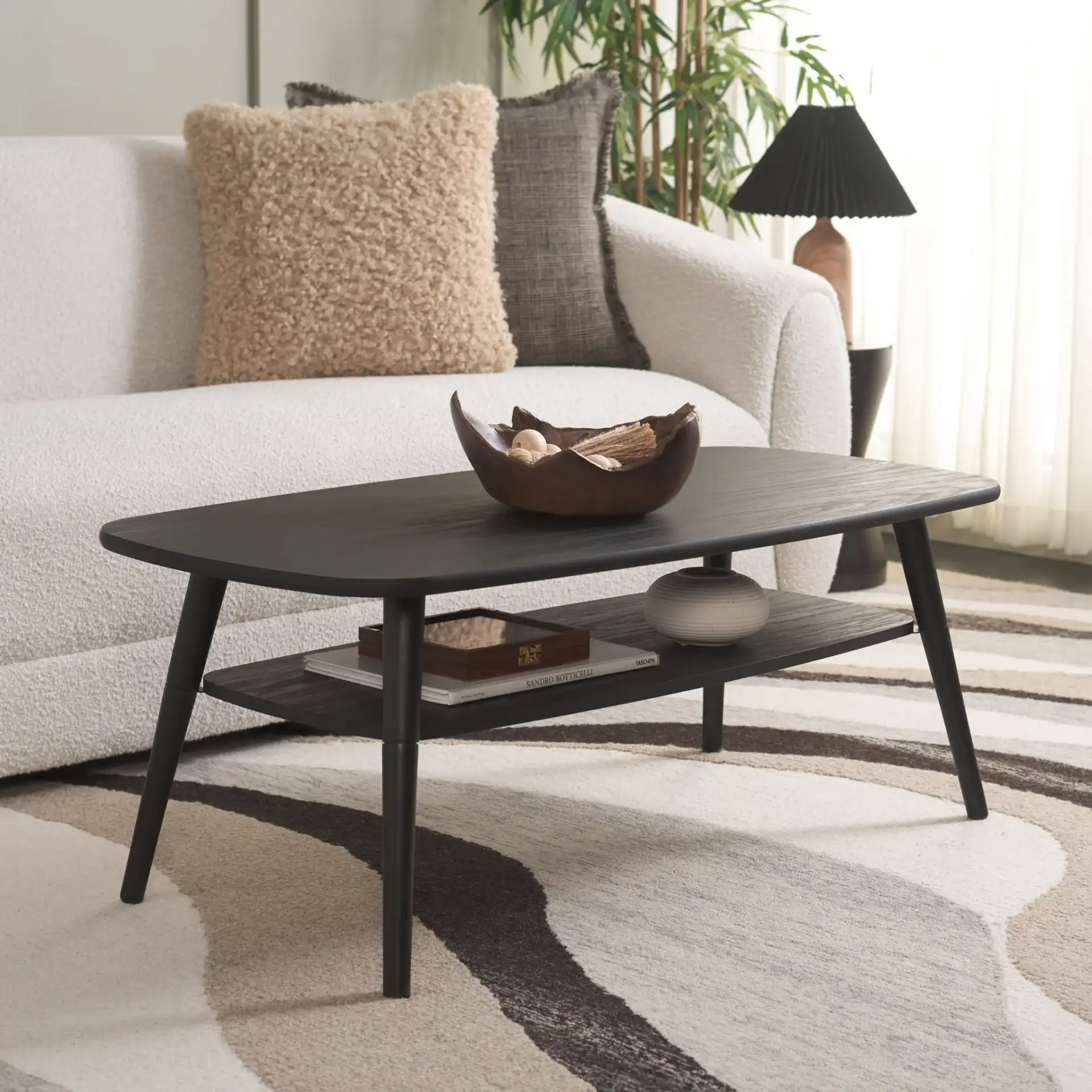 Karou Two-Tier Coffee Table in Black in a styled room