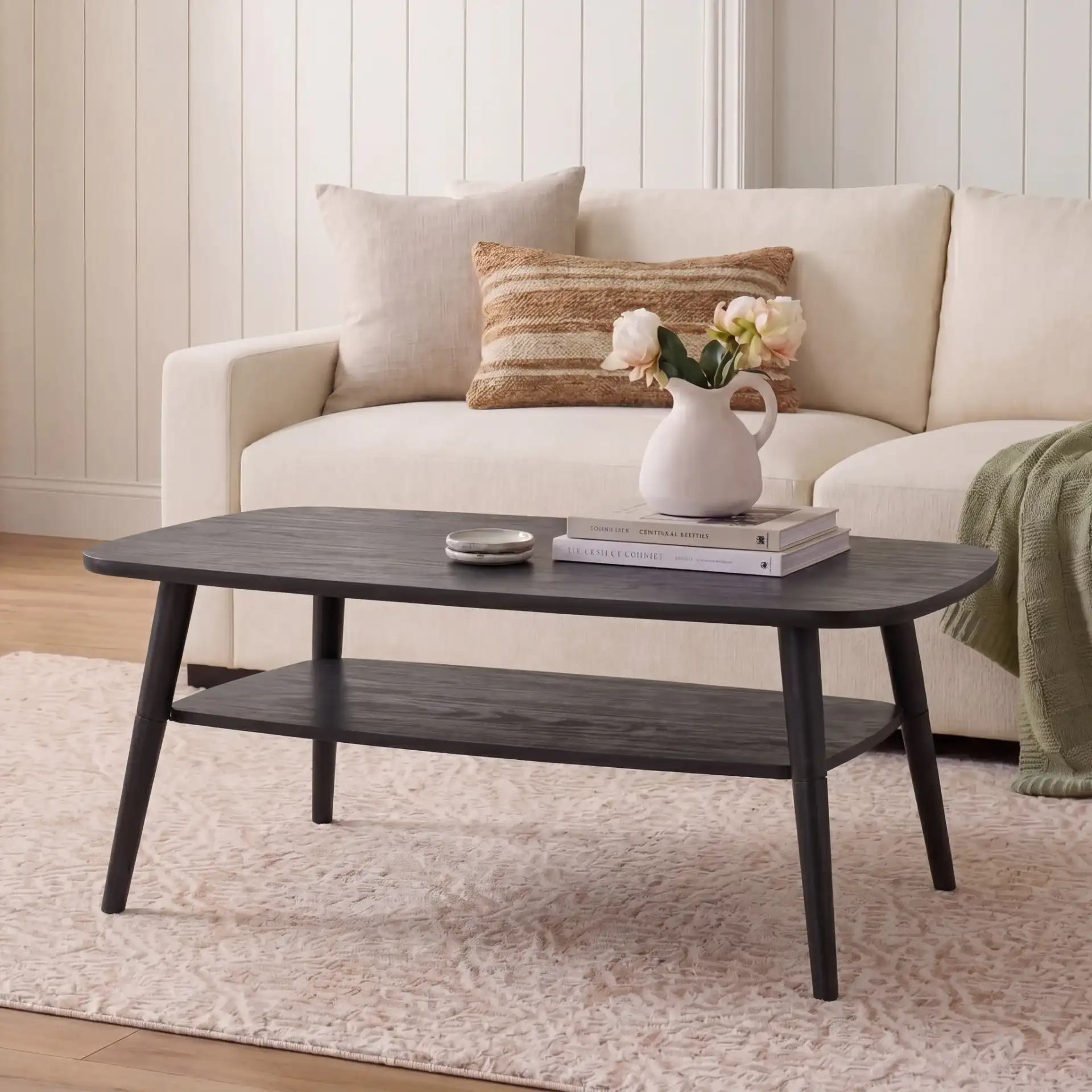 Karou Two-Tier Coffee Table in Black in a styled room
