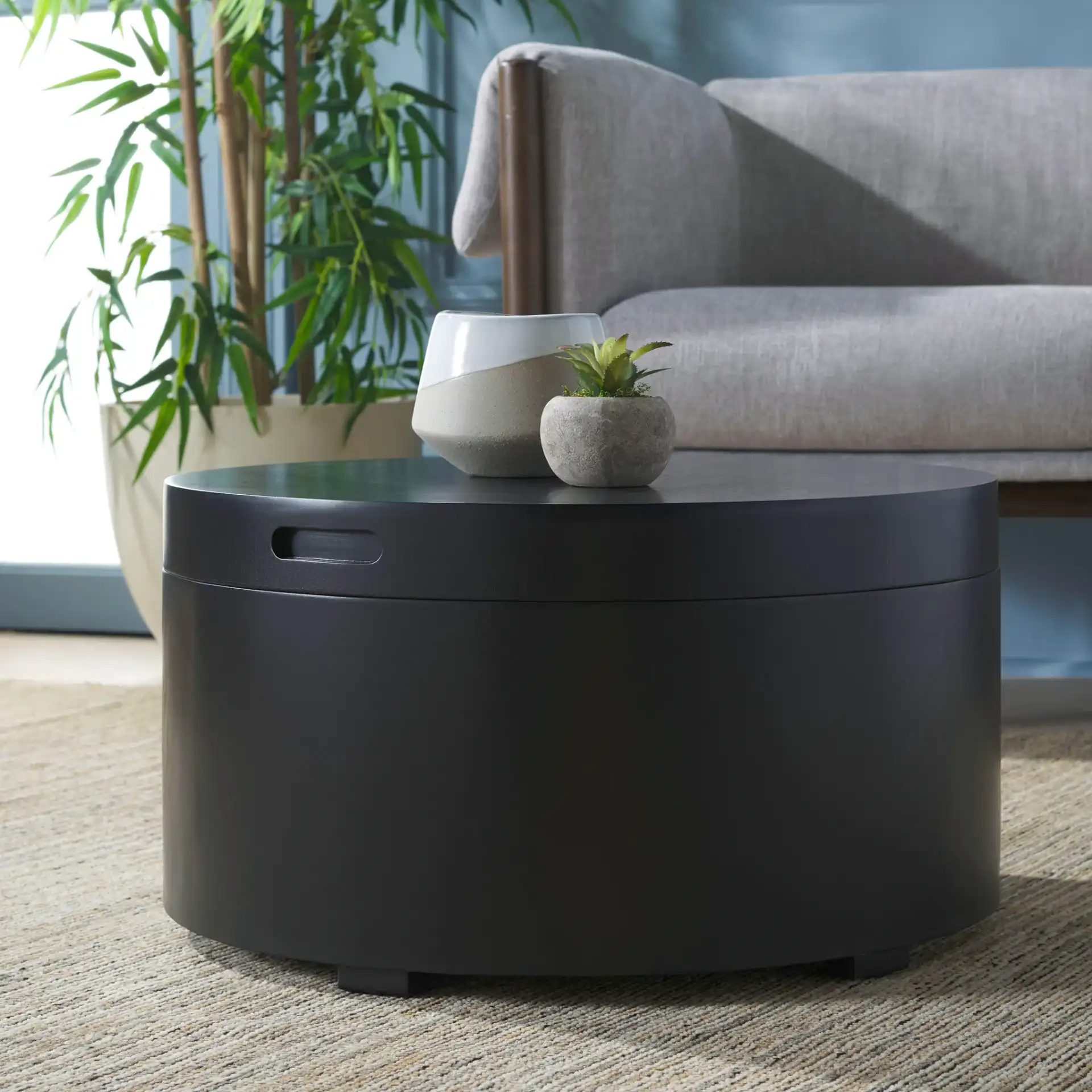 Rafaela Round Coffee Table in Black in a styled room