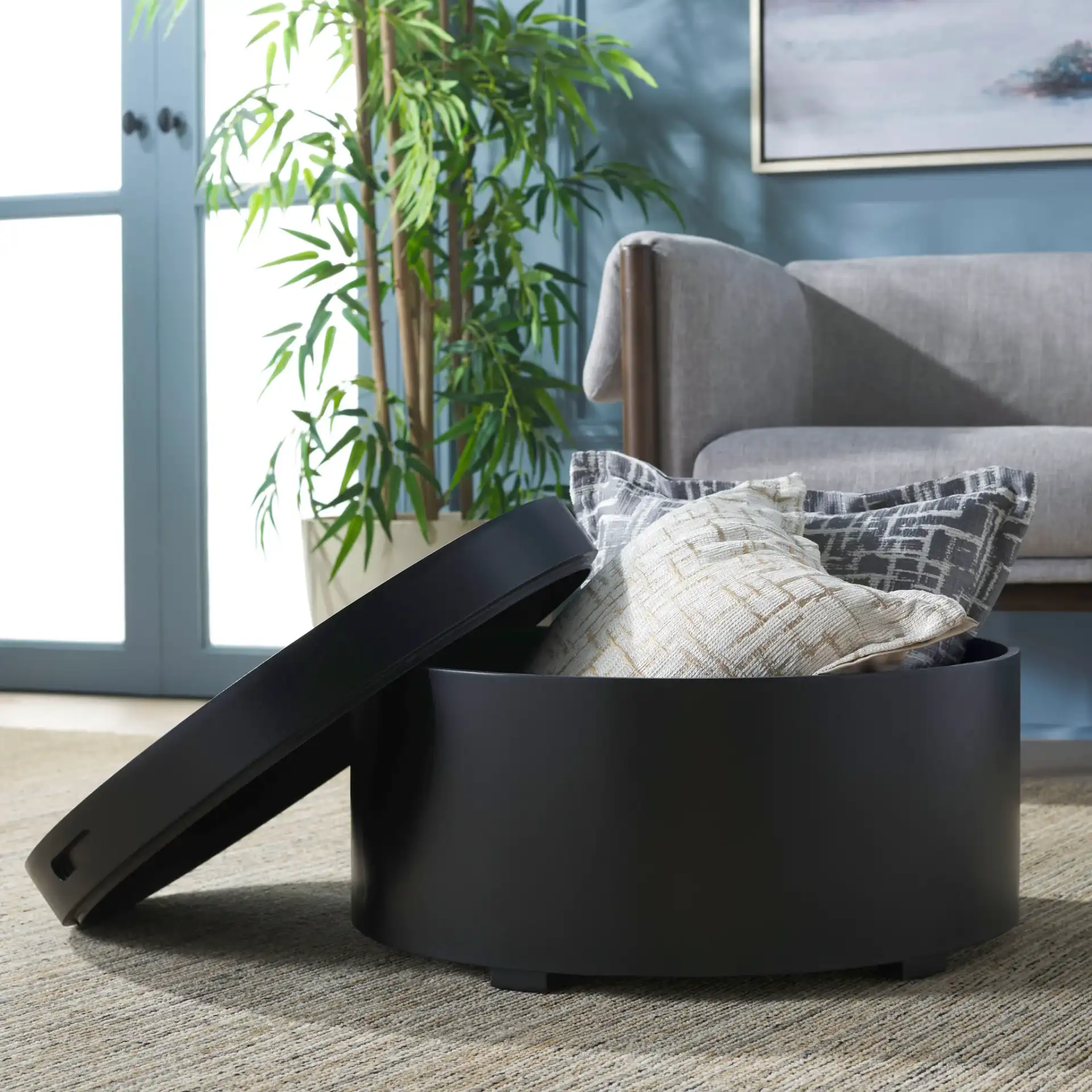 Rafaela Round Coffee Table in Black in a styled room
