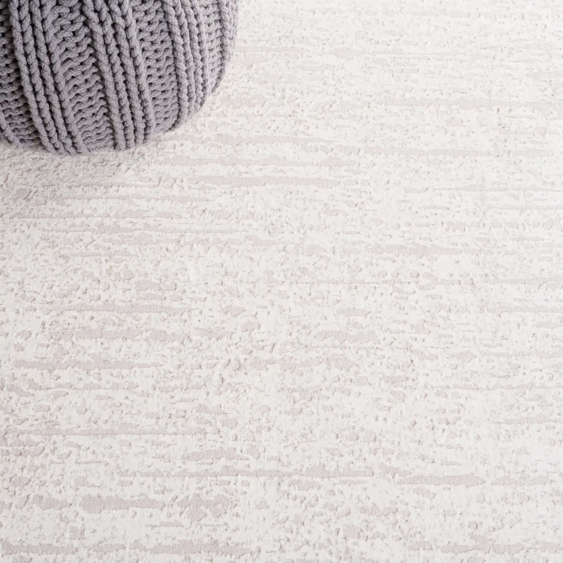 Continental Striated Abstract Rug in Ivory / Beige in a styled room