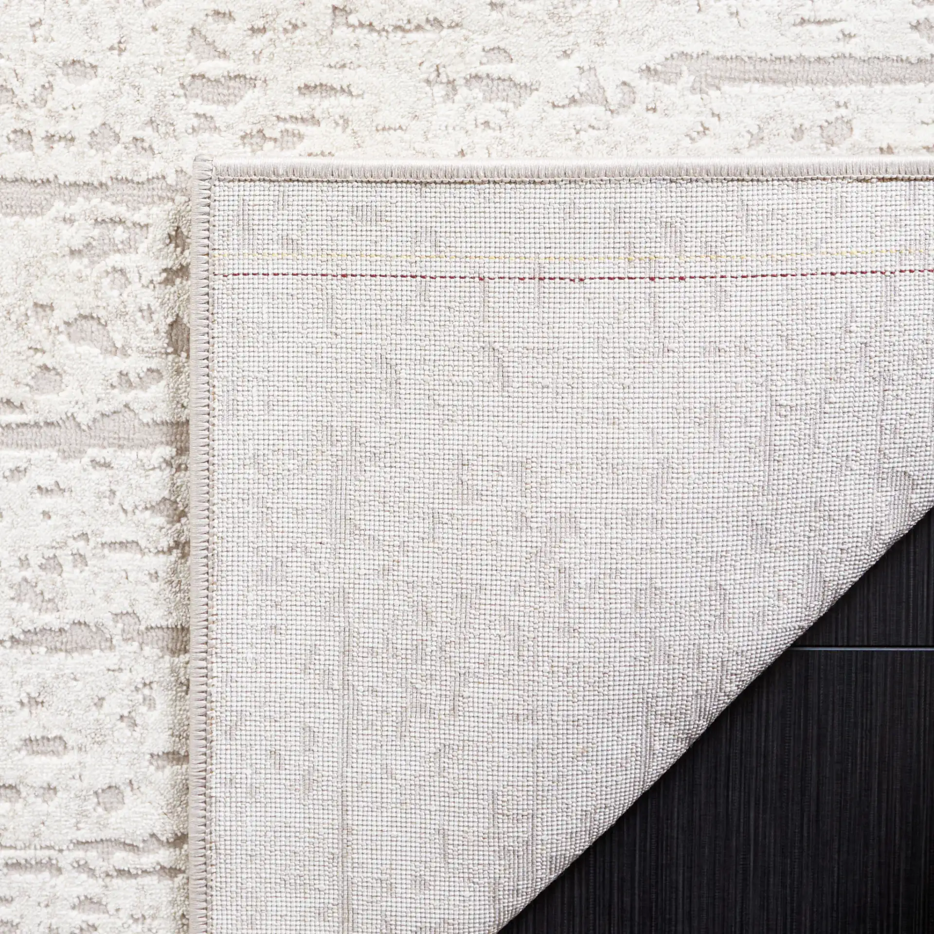 Continental Striated Abstract Rug in Ivory / Beige in a styled room
