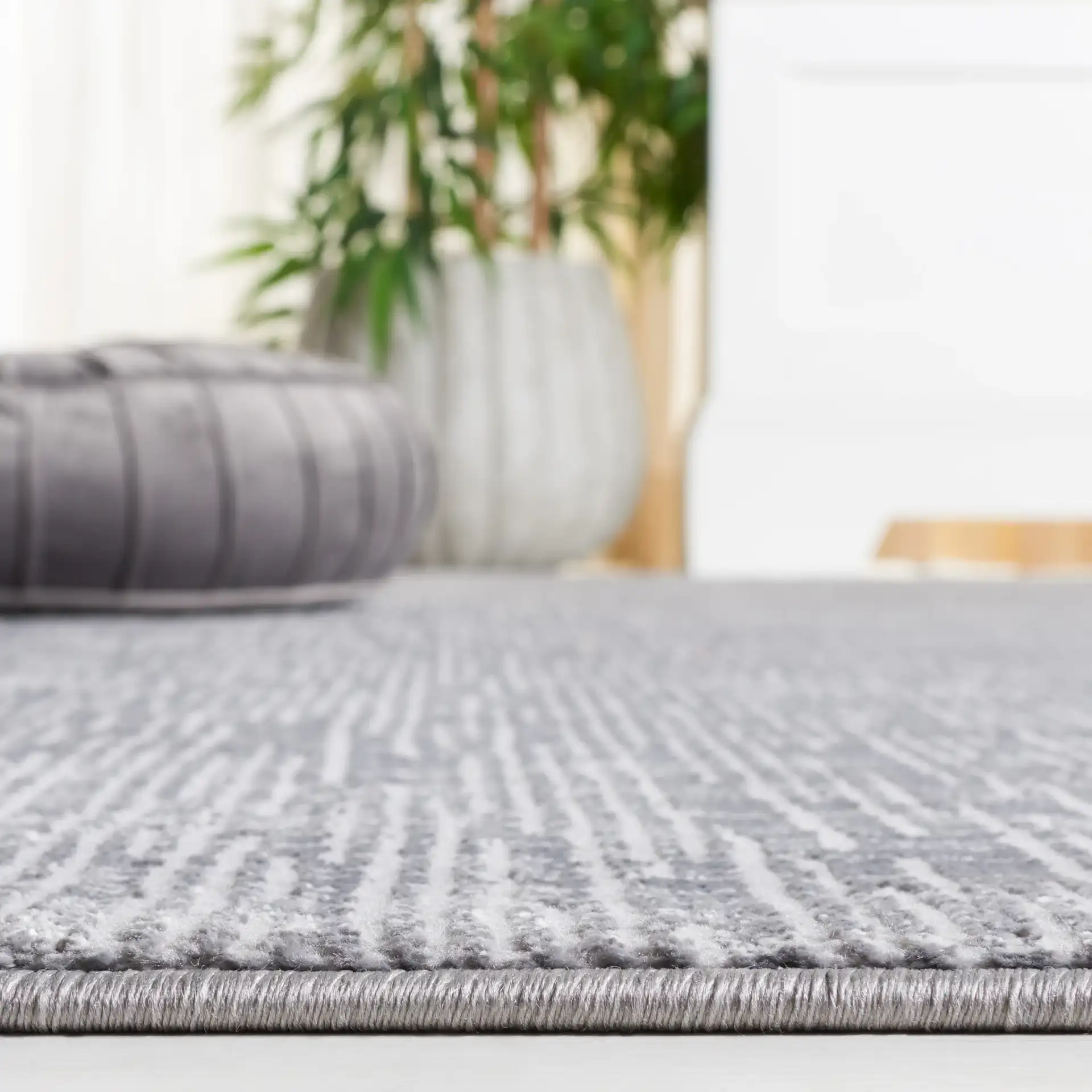 Continental Textured Linear Rug in Dark Gray / Light Gray in a styled room
