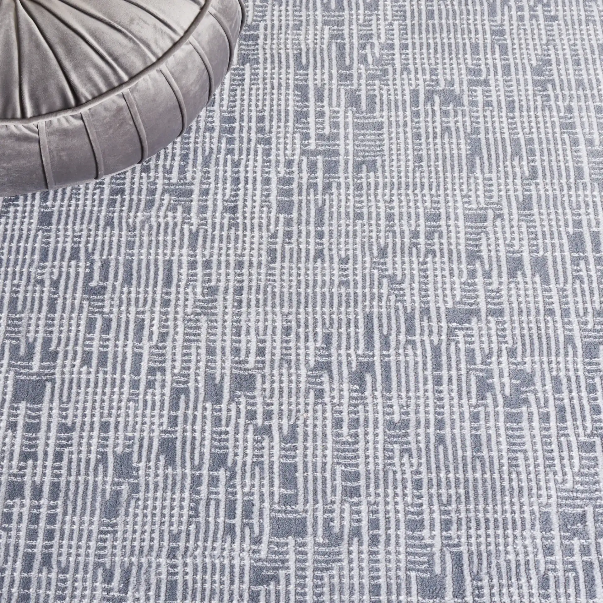 Continental Textured Linear Rug in Dark Gray / Light Gray in a styled room