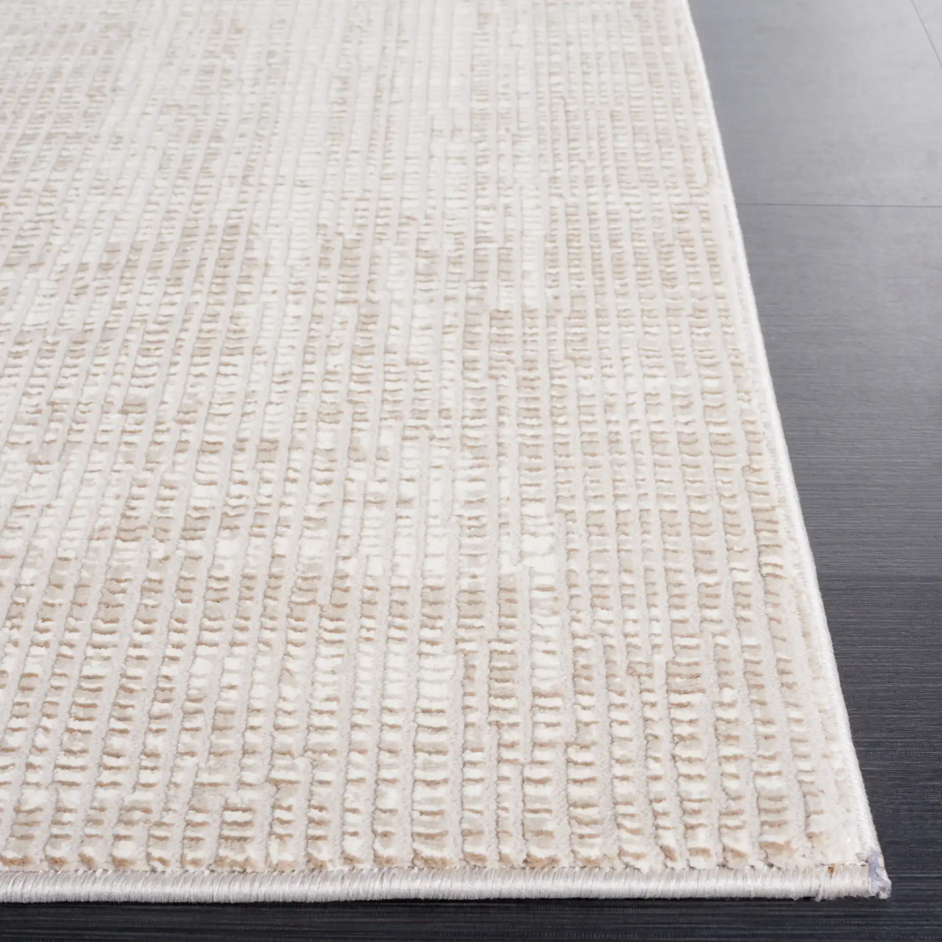 Continental Textured Border Rug in Ivory / Beige in a styled room