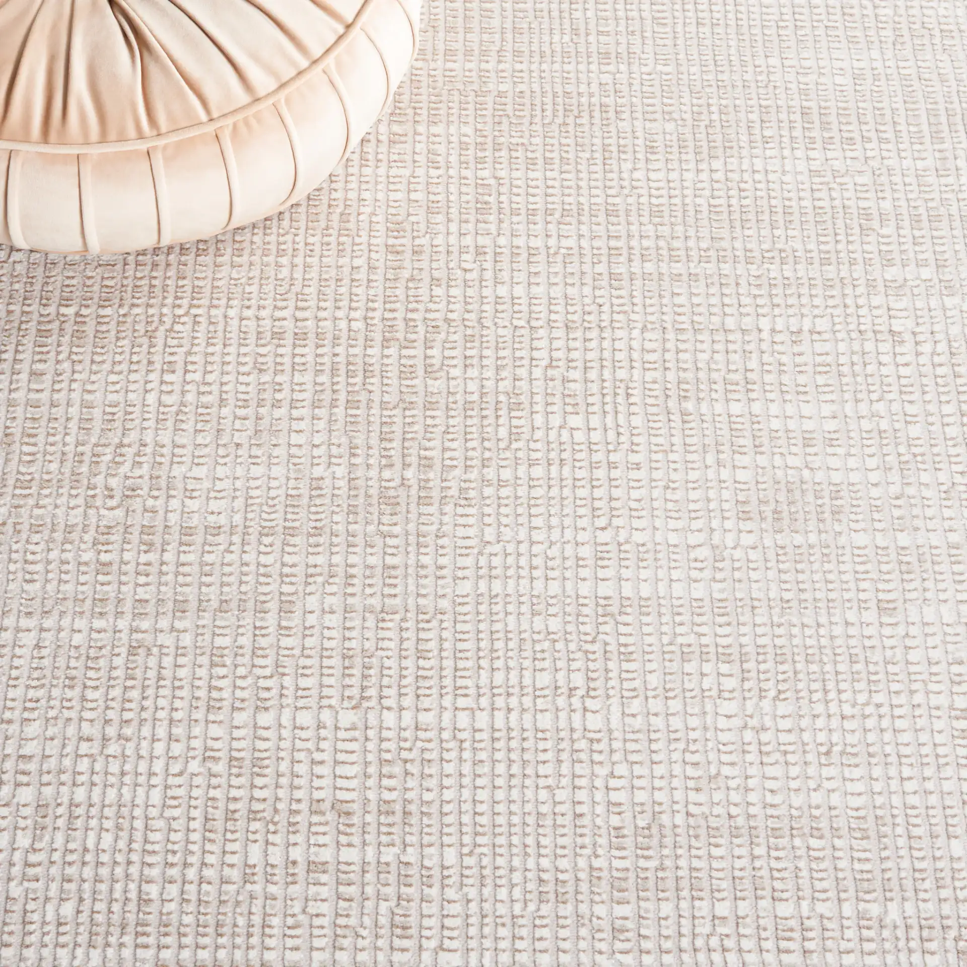 Continental Textured Border Rug in Ivory / Beige in a styled room