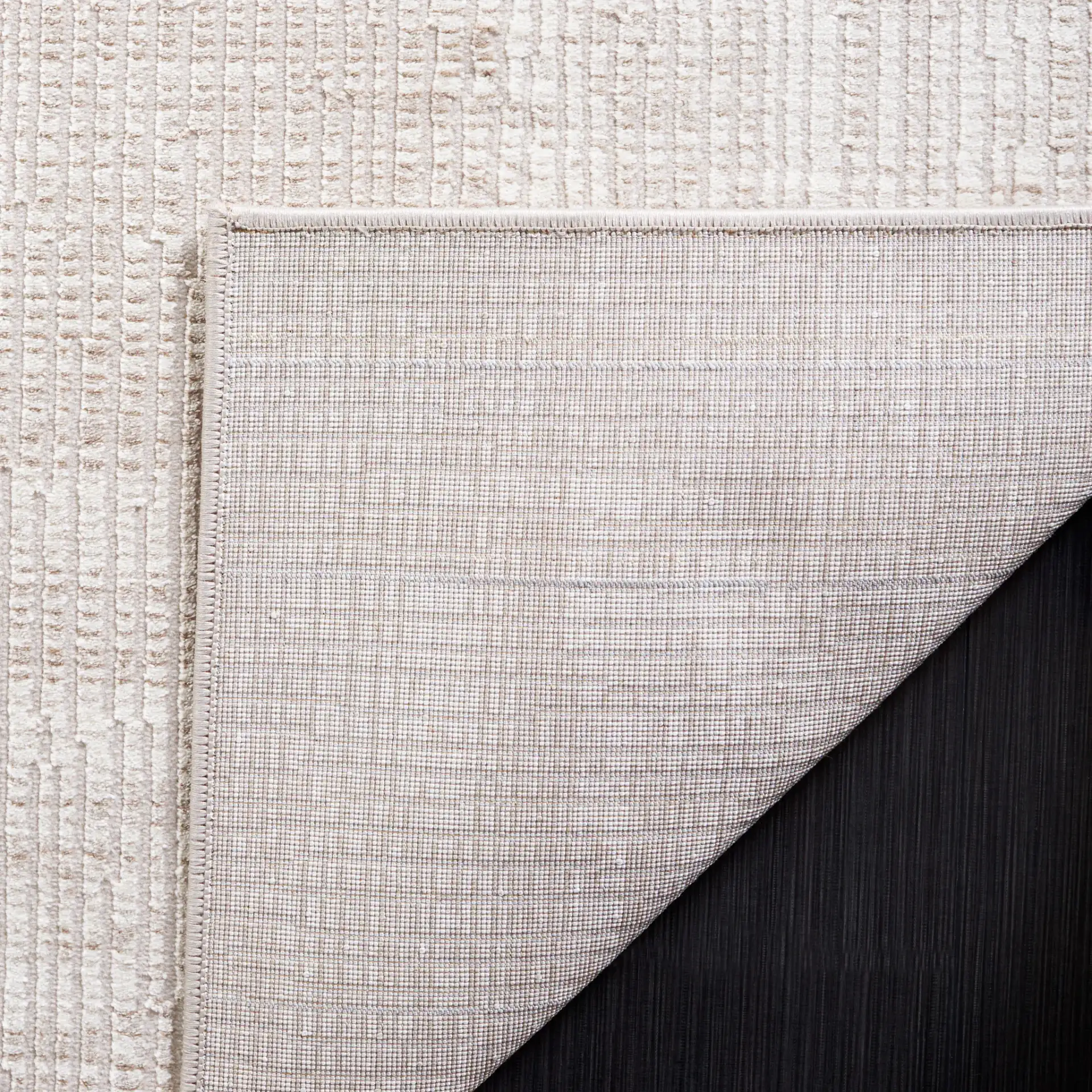 Continental Textured Border Rug in Ivory / Beige in a styled room
