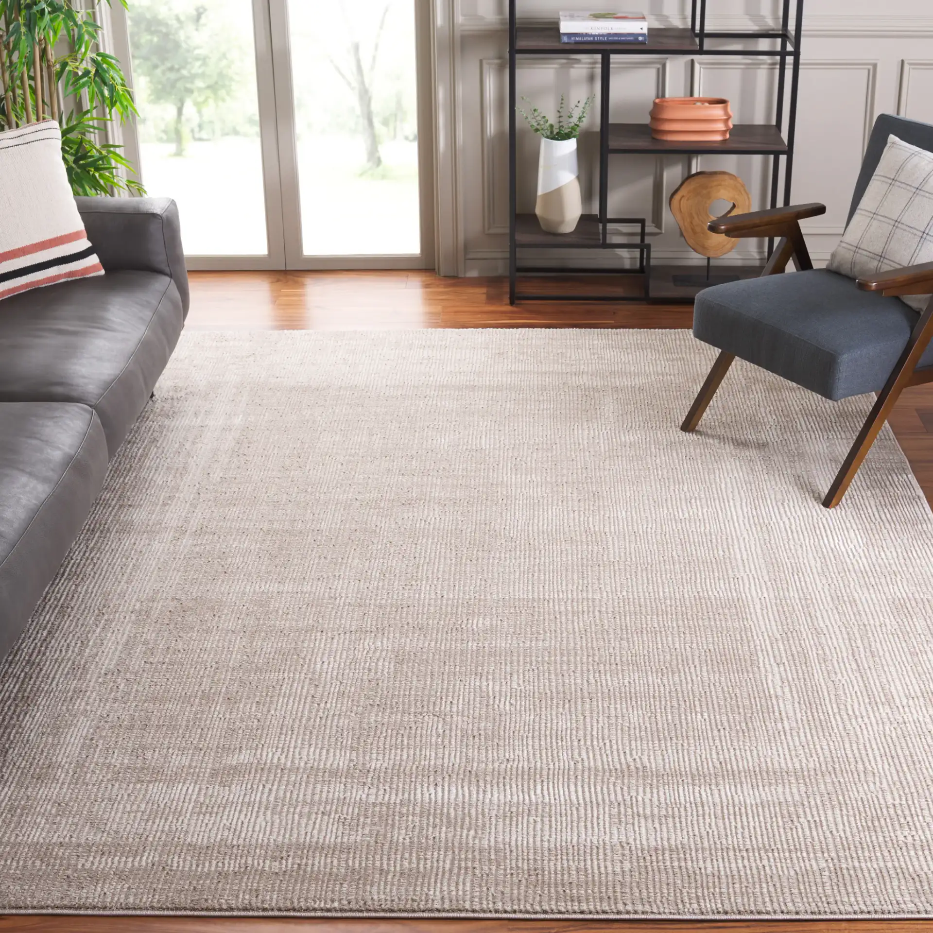 Continental Textured Border Rug in Ivory / Beige in a styled room