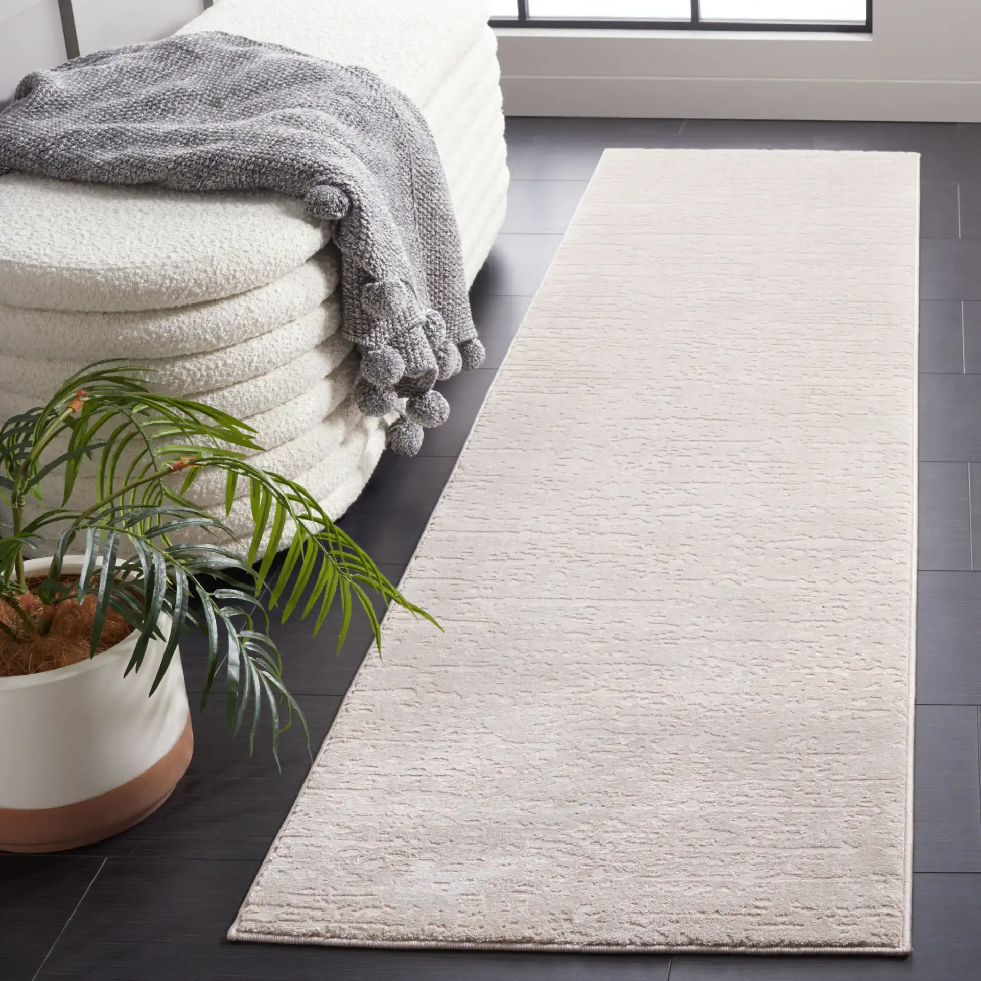 Continental Textured Solid Rug in Beige in a styled room