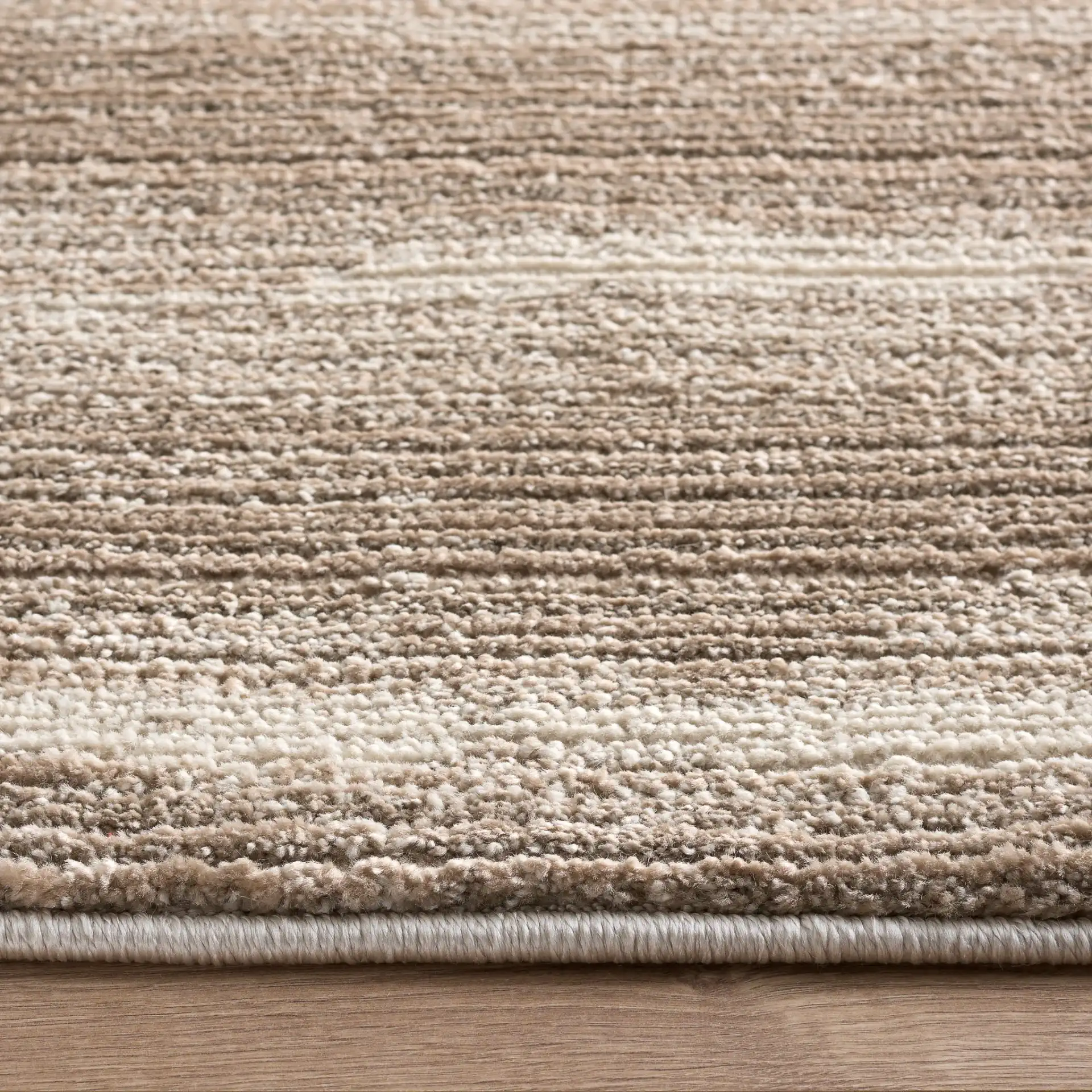 Cooper Modern Striated Rug in Beige / Ivory in a styled room