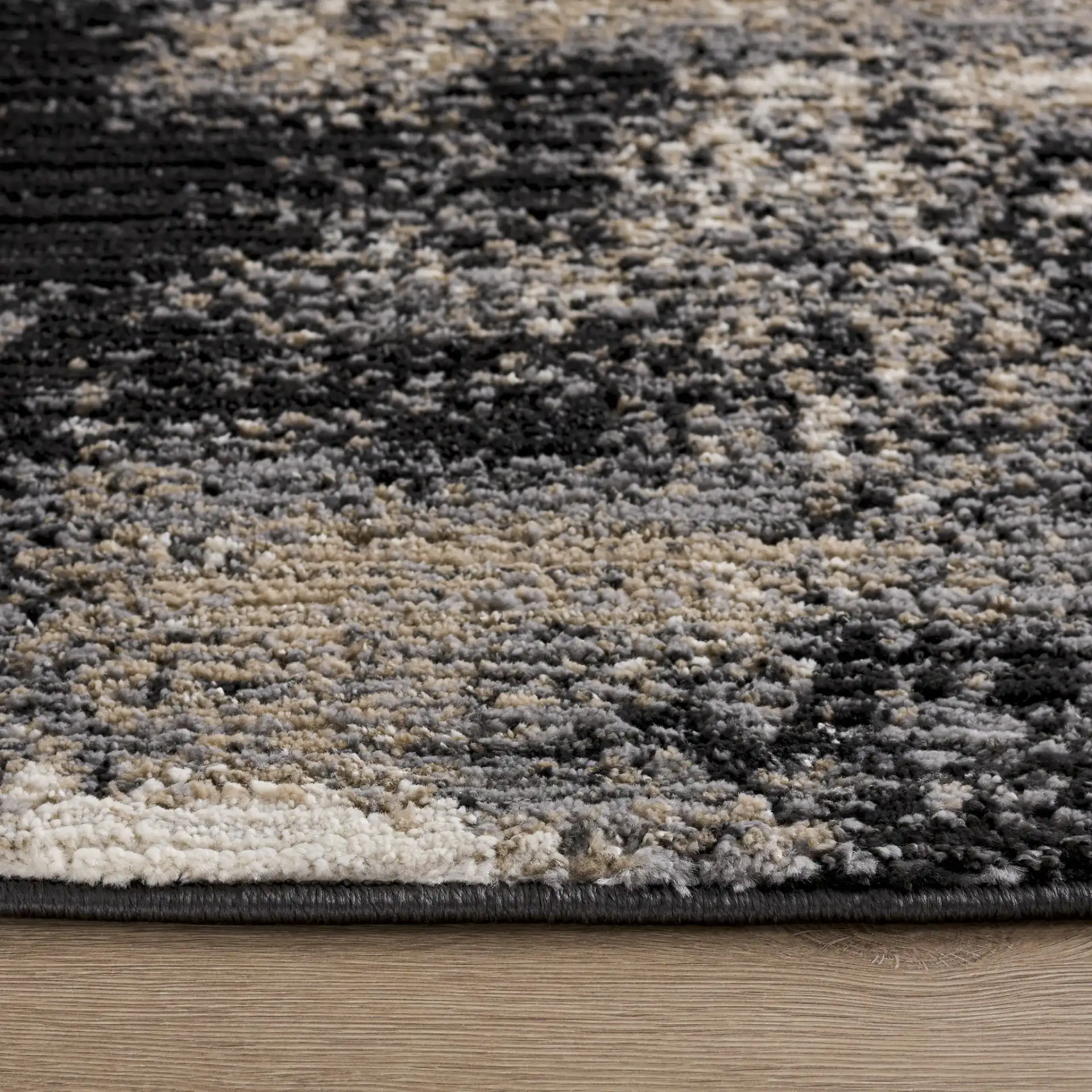 Cooper Modern Abstract Rug in Black / Ivory in a styled room